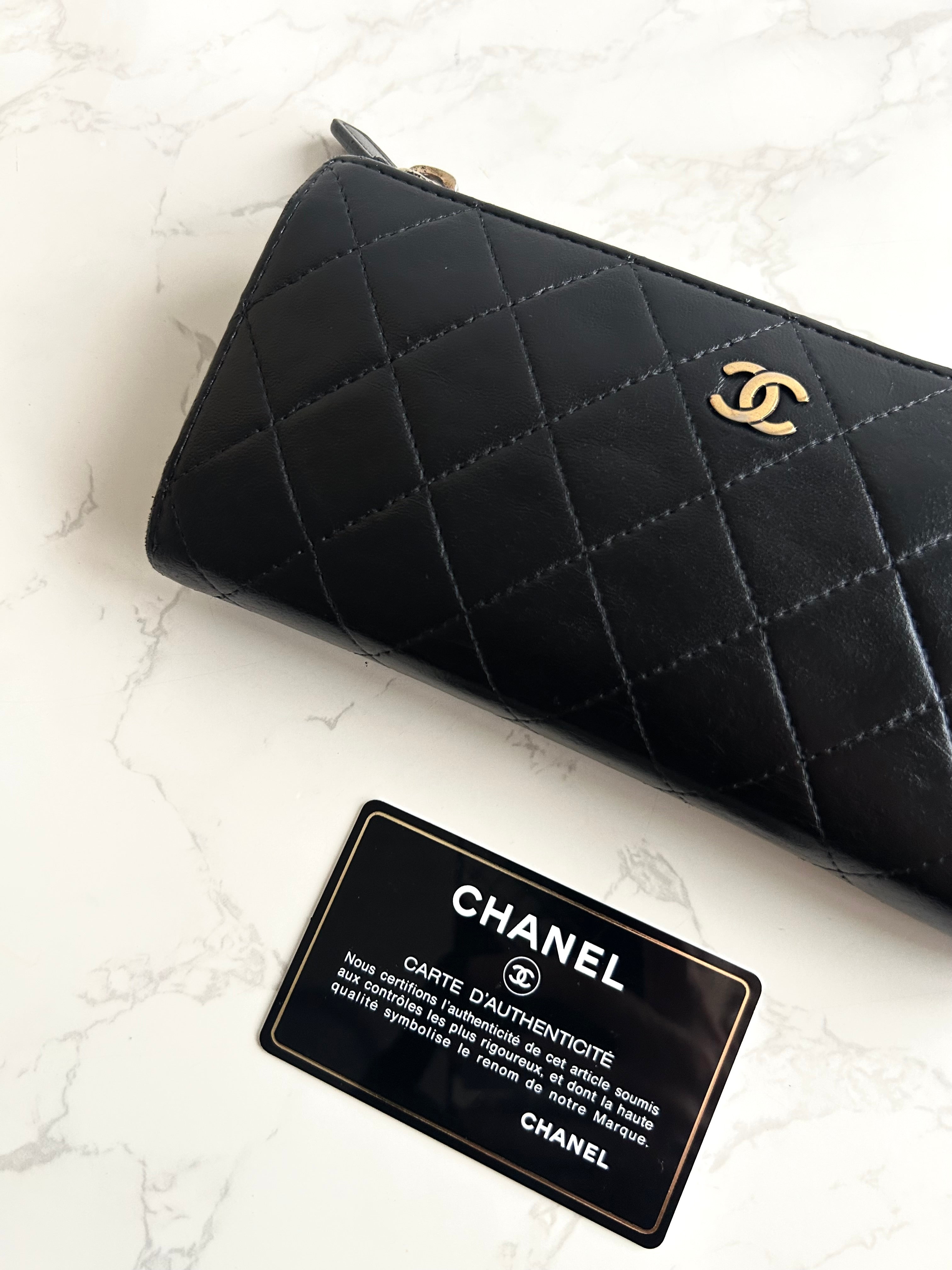 Recent season Chanel black and gold lambskin long wallet