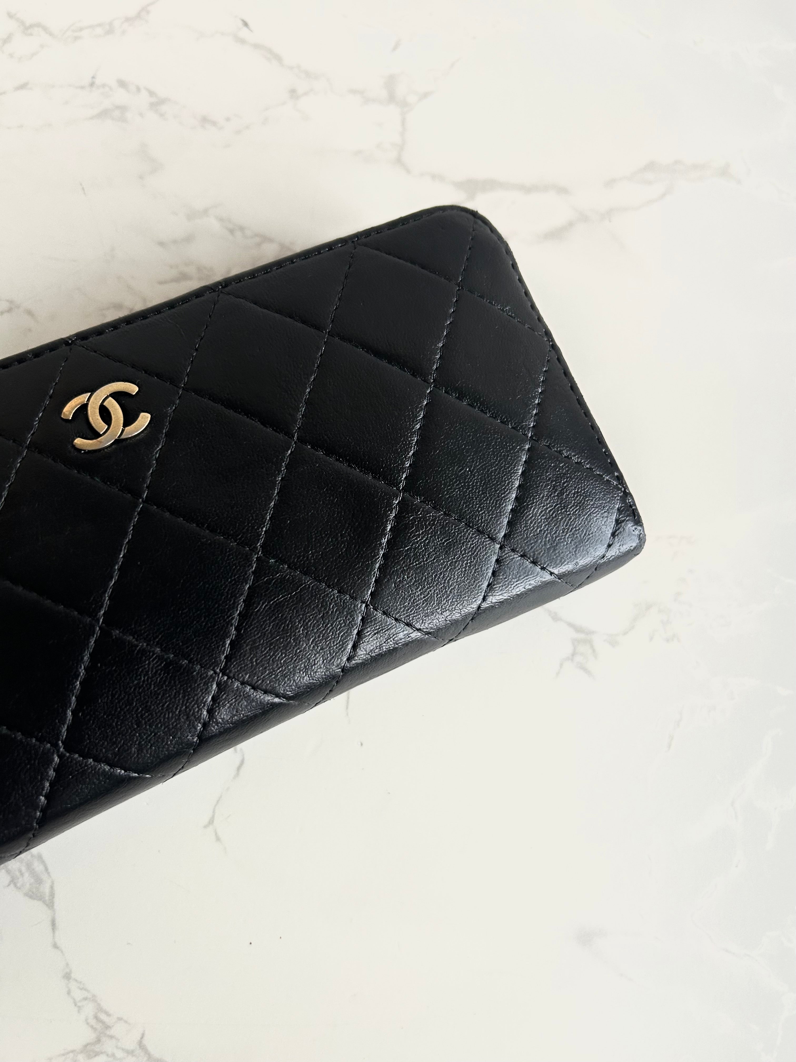 Recent season Chanel black and gold lambskin long wallet