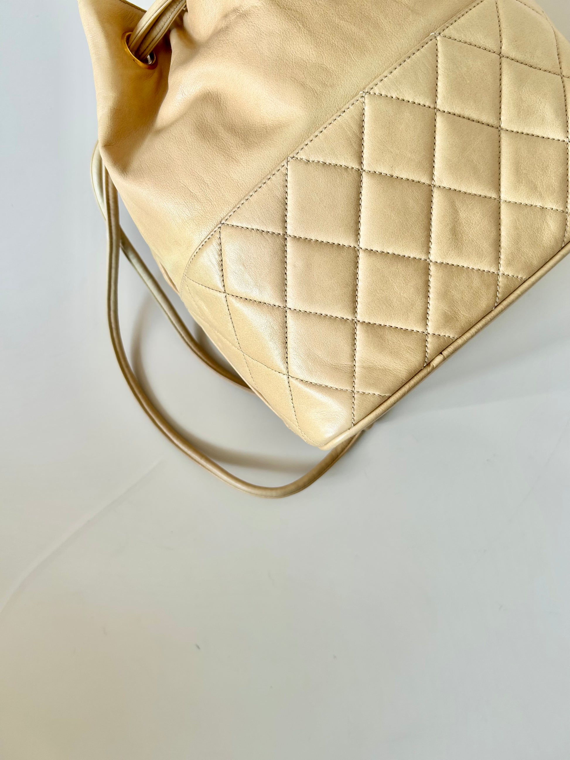 CHANEL rare beige lambskin double gold ball drawstring small bucket / side bag