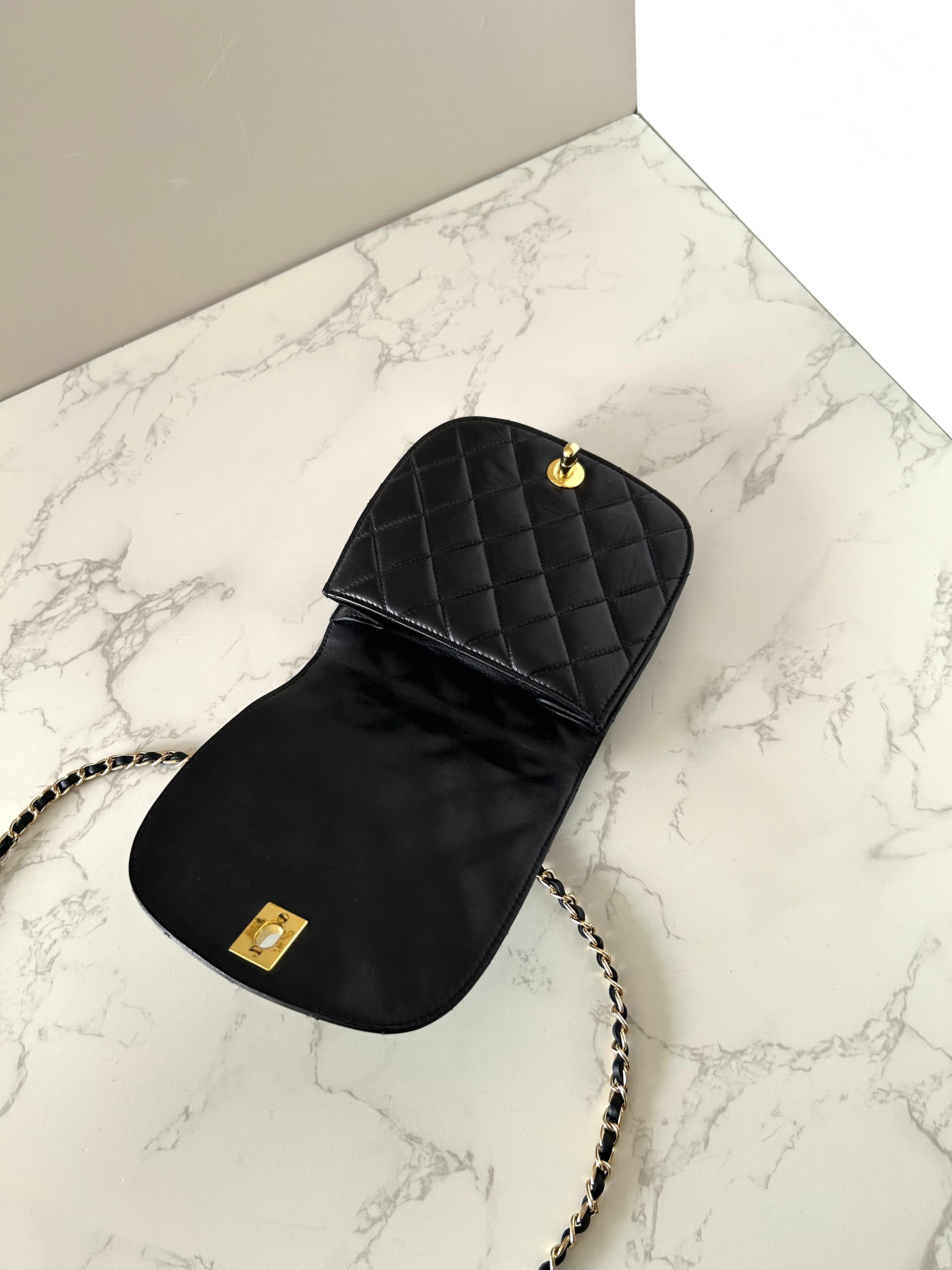 CHANEL rare black lambskin leather swivel buckle saddle bag / clutch / oblique bag