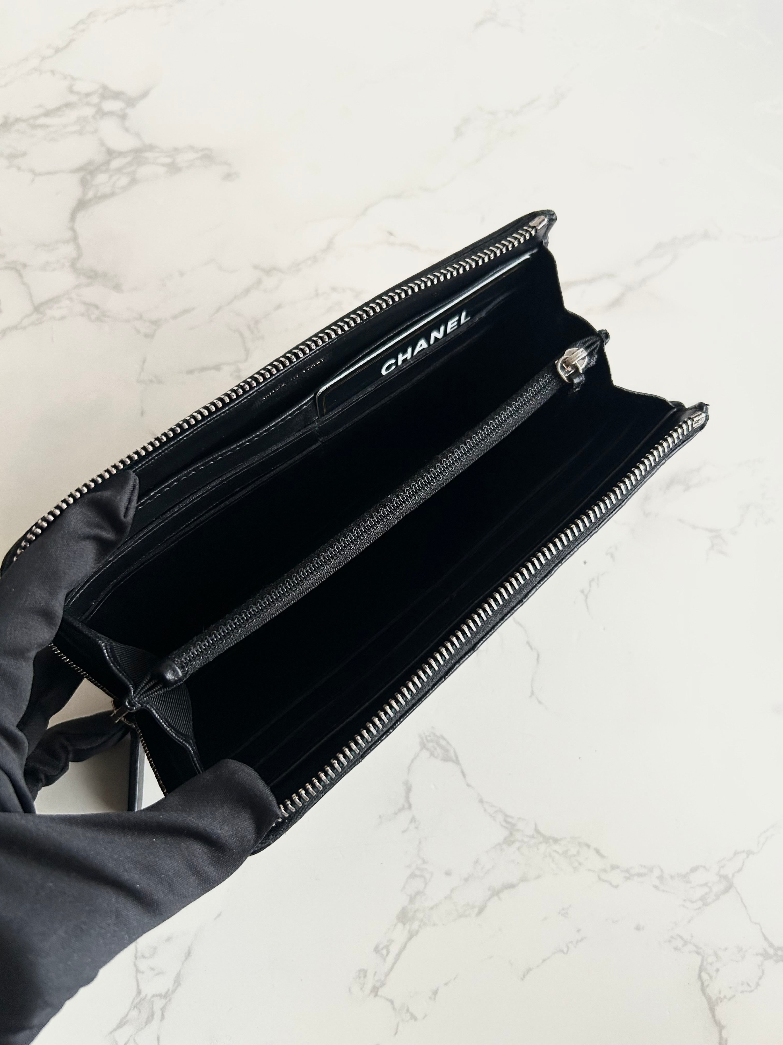 Recent season Chanel black and gold lambskin long wallet