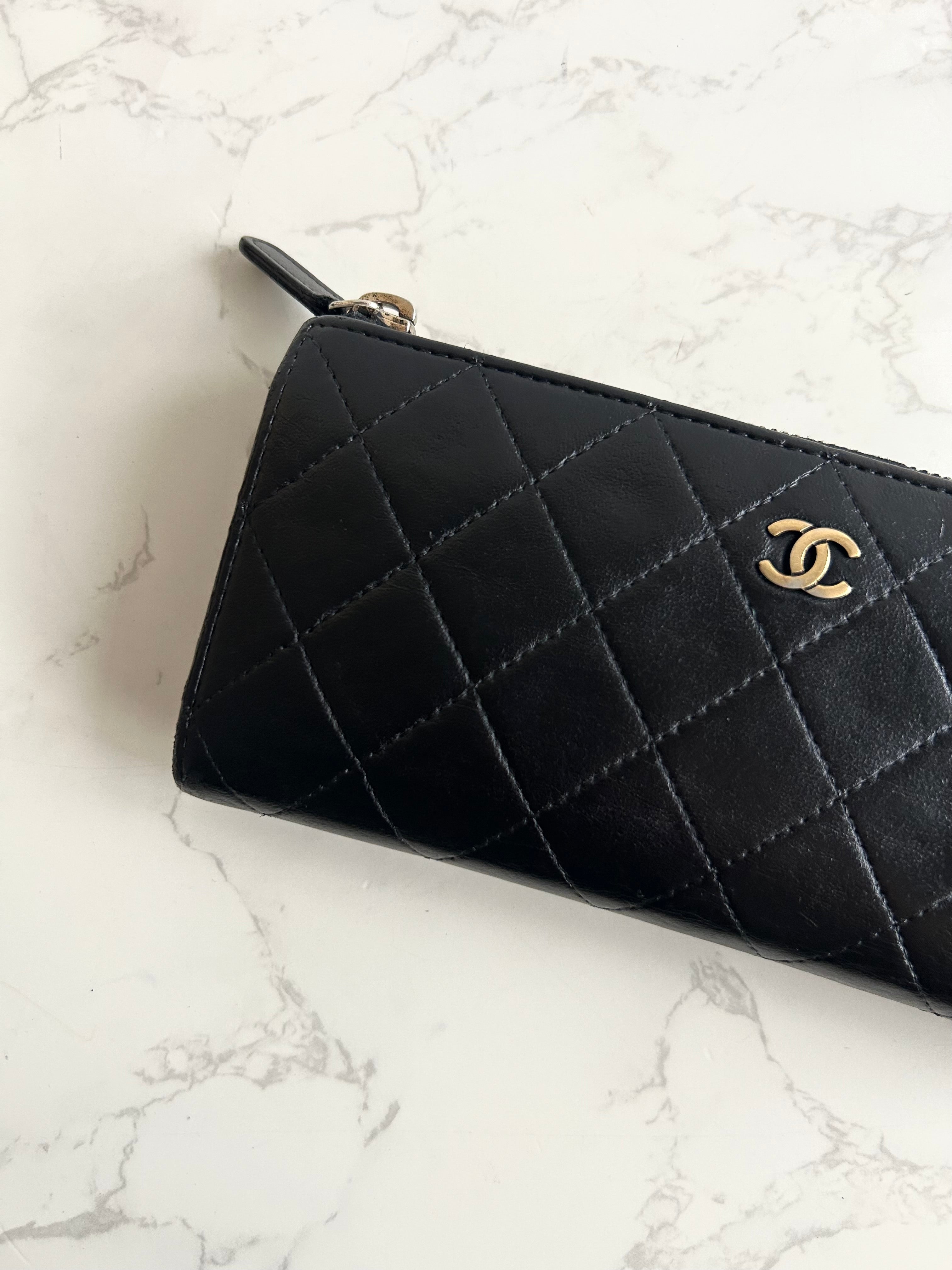Recent season Chanel black and gold lambskin long wallet