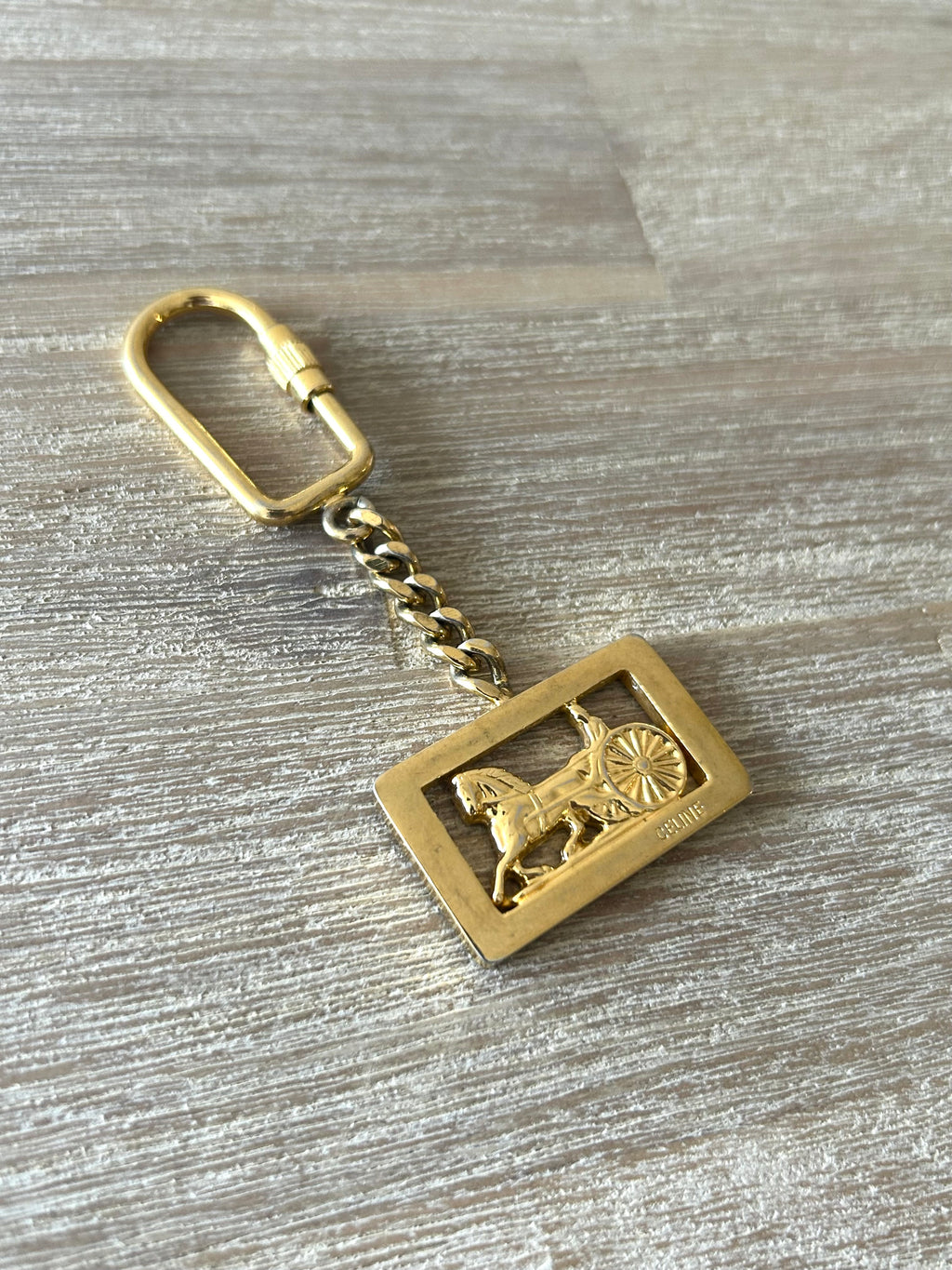 女神節滿額 HKD$3888贈品 - CELINE 經典金色馬車鎖匙扣