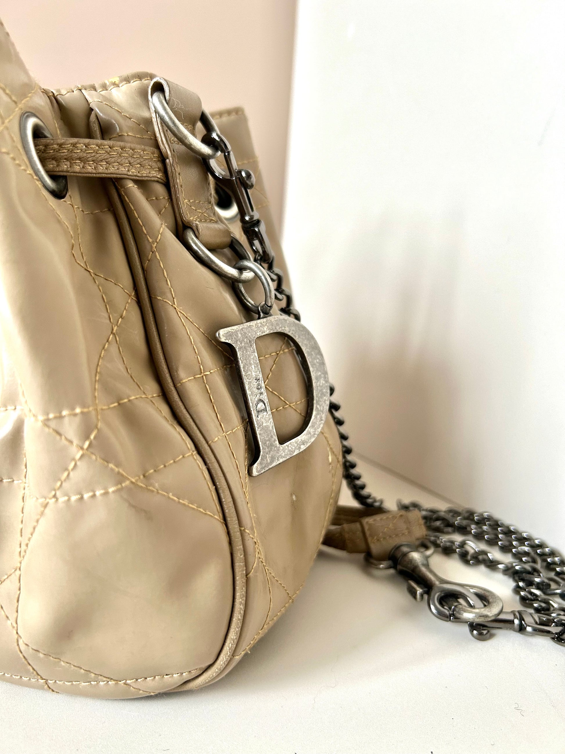 CHRISTIAN DOR beige leather silver buckle drawstring small bucket bag / side backpack / shoulder bag