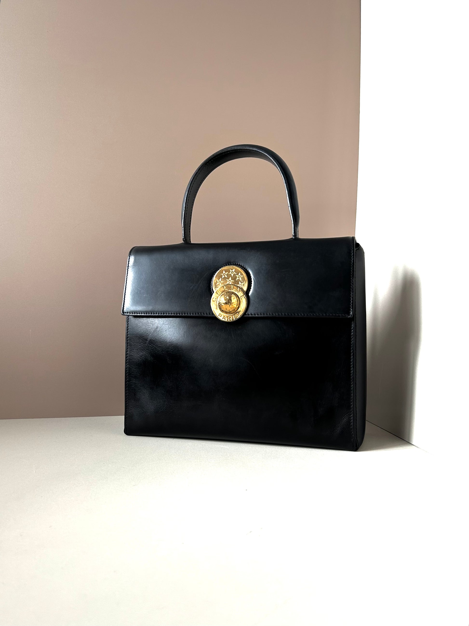 CELINE rare rotating moving gold planet black leather Kelly small bag / handbag