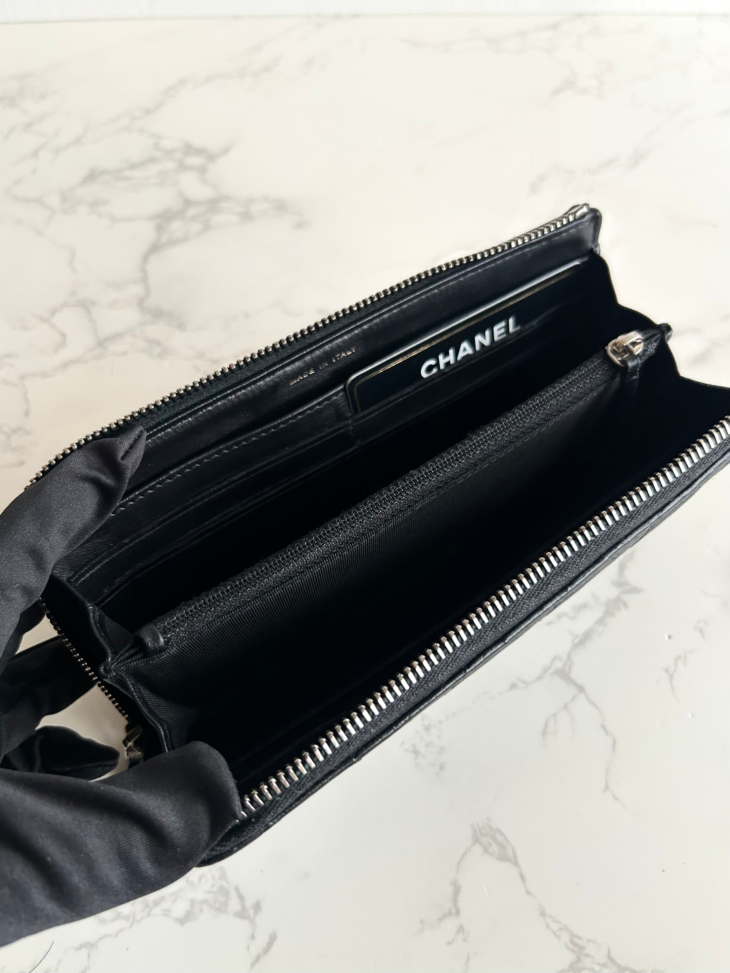Recent season Chanel black and gold lambskin long wallet