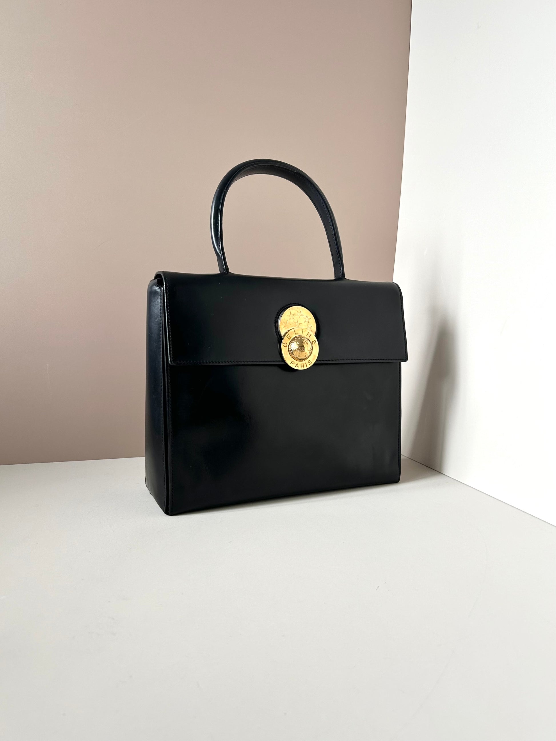 CELINE rare rotating moving gold planet black leather Kelly small bag / handbag