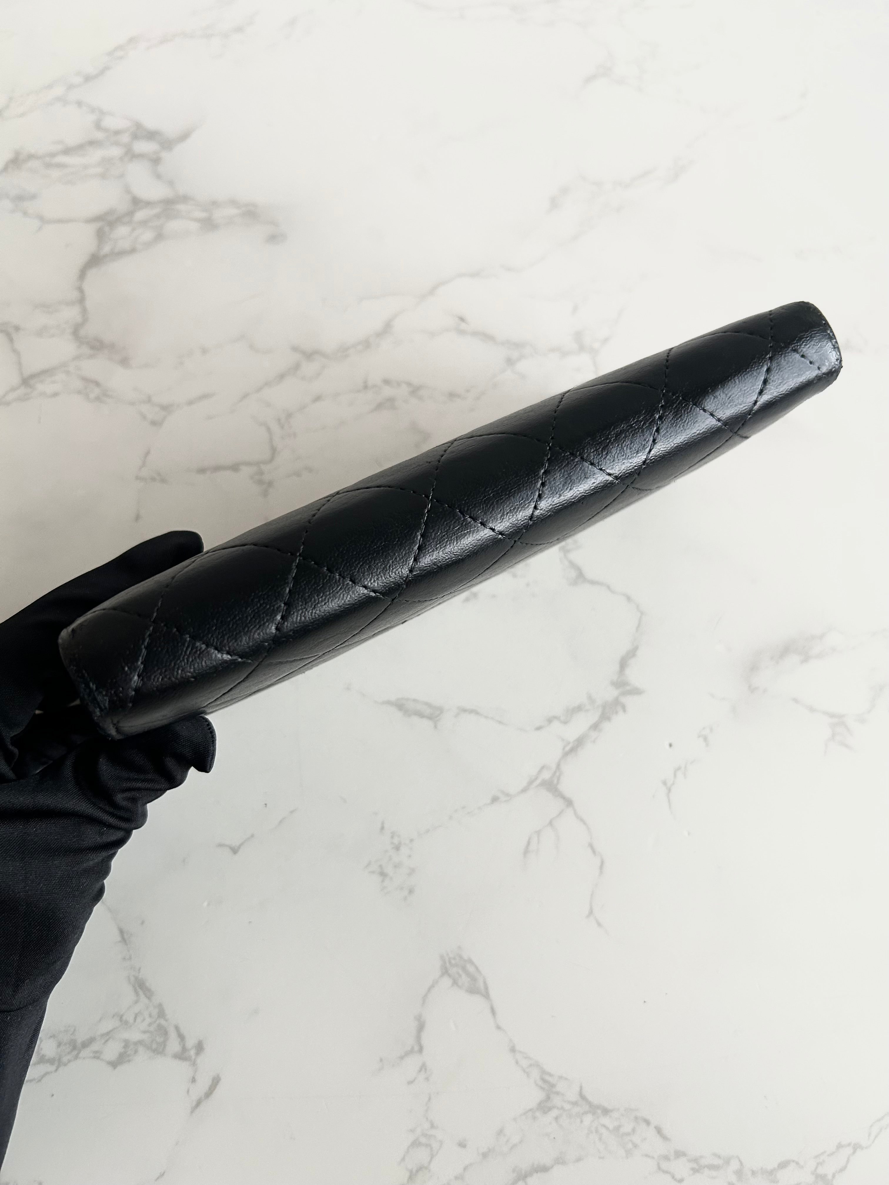 Recent season Chanel black and gold lambskin long wallet