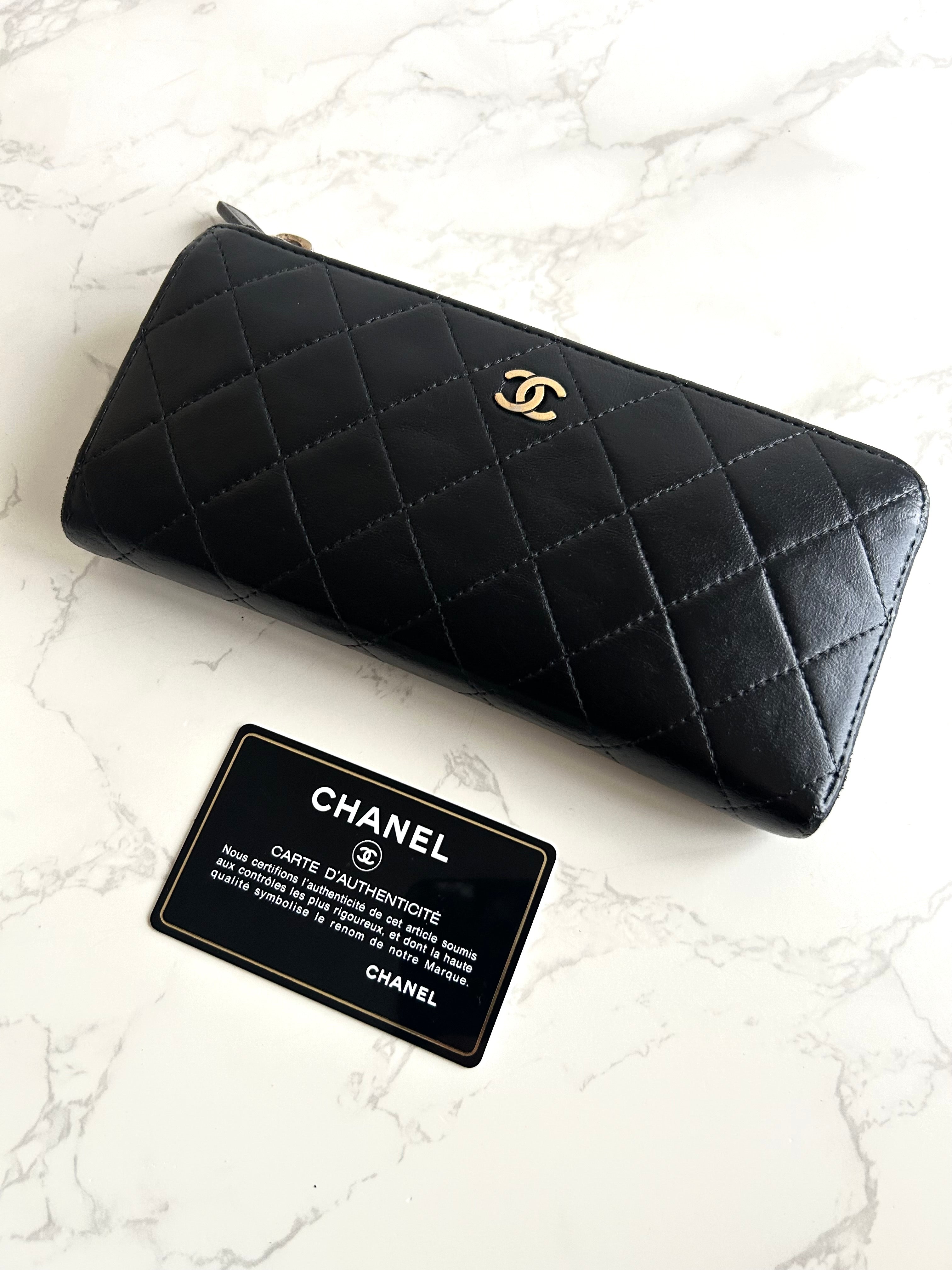 Recent season Chanel black and gold lambskin long wallet
