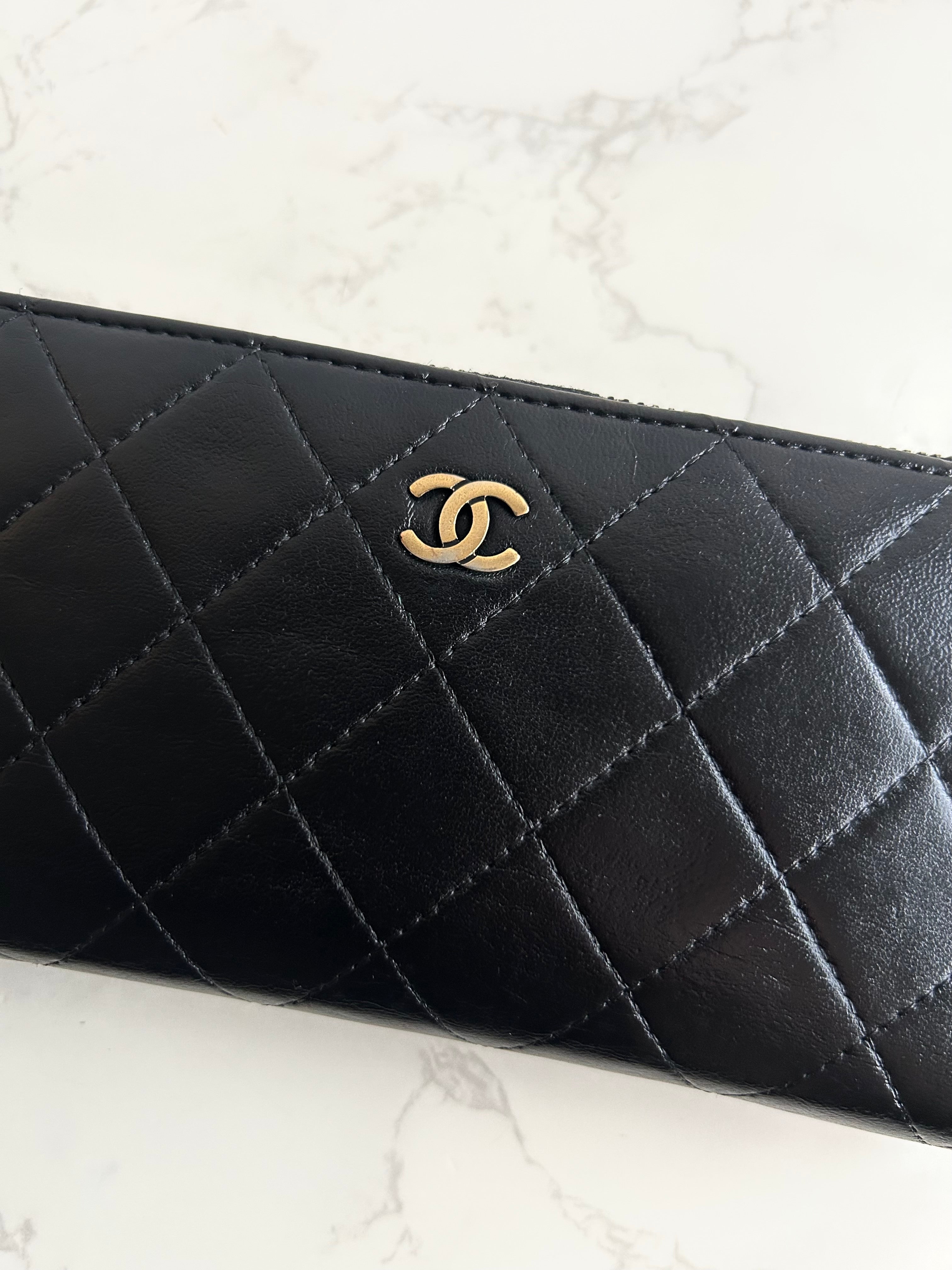Recent season Chanel black and gold lambskin long wallet