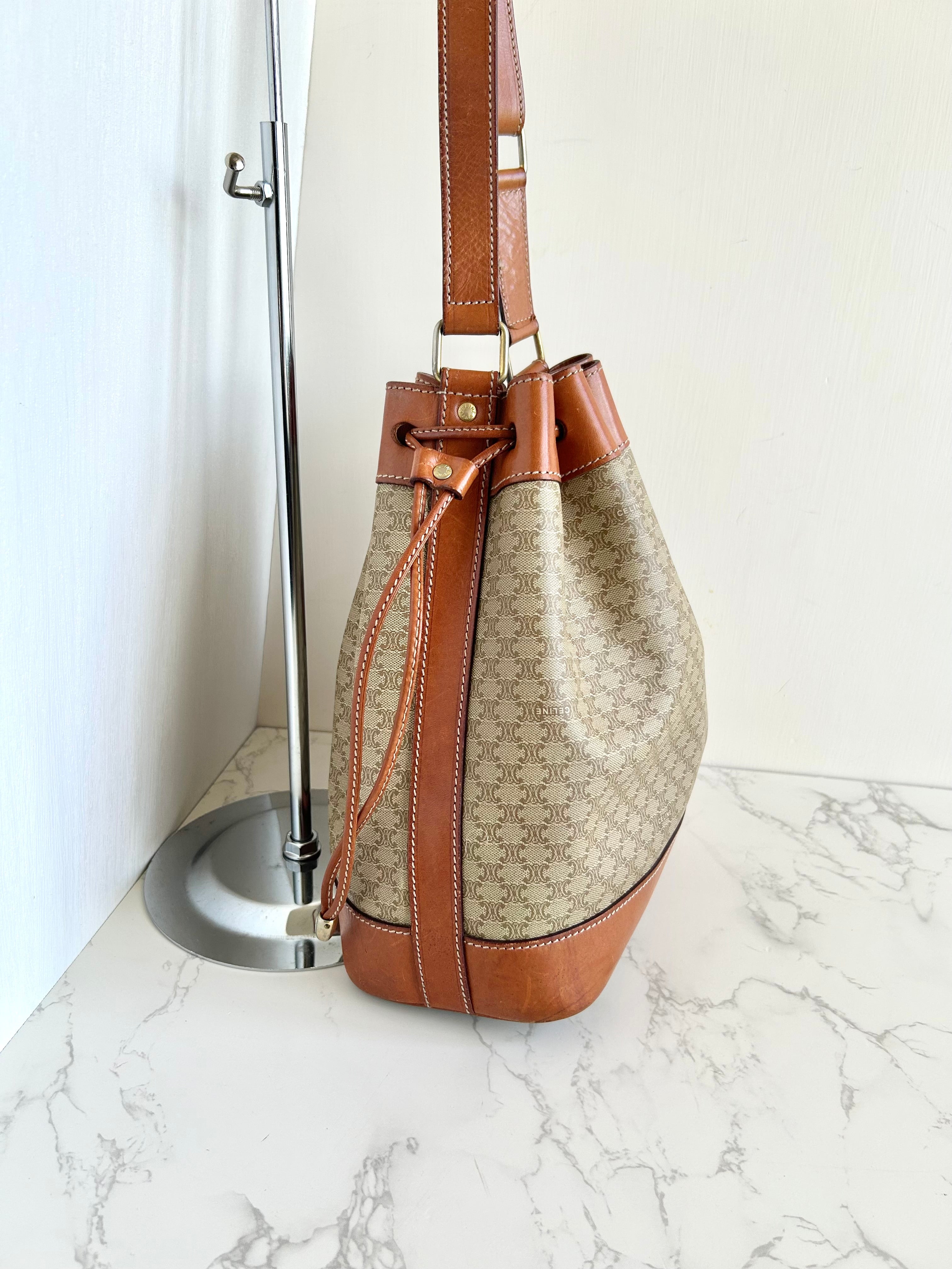 CELINE beige old flower leather shoulder drawstring bucket bag / side backpack