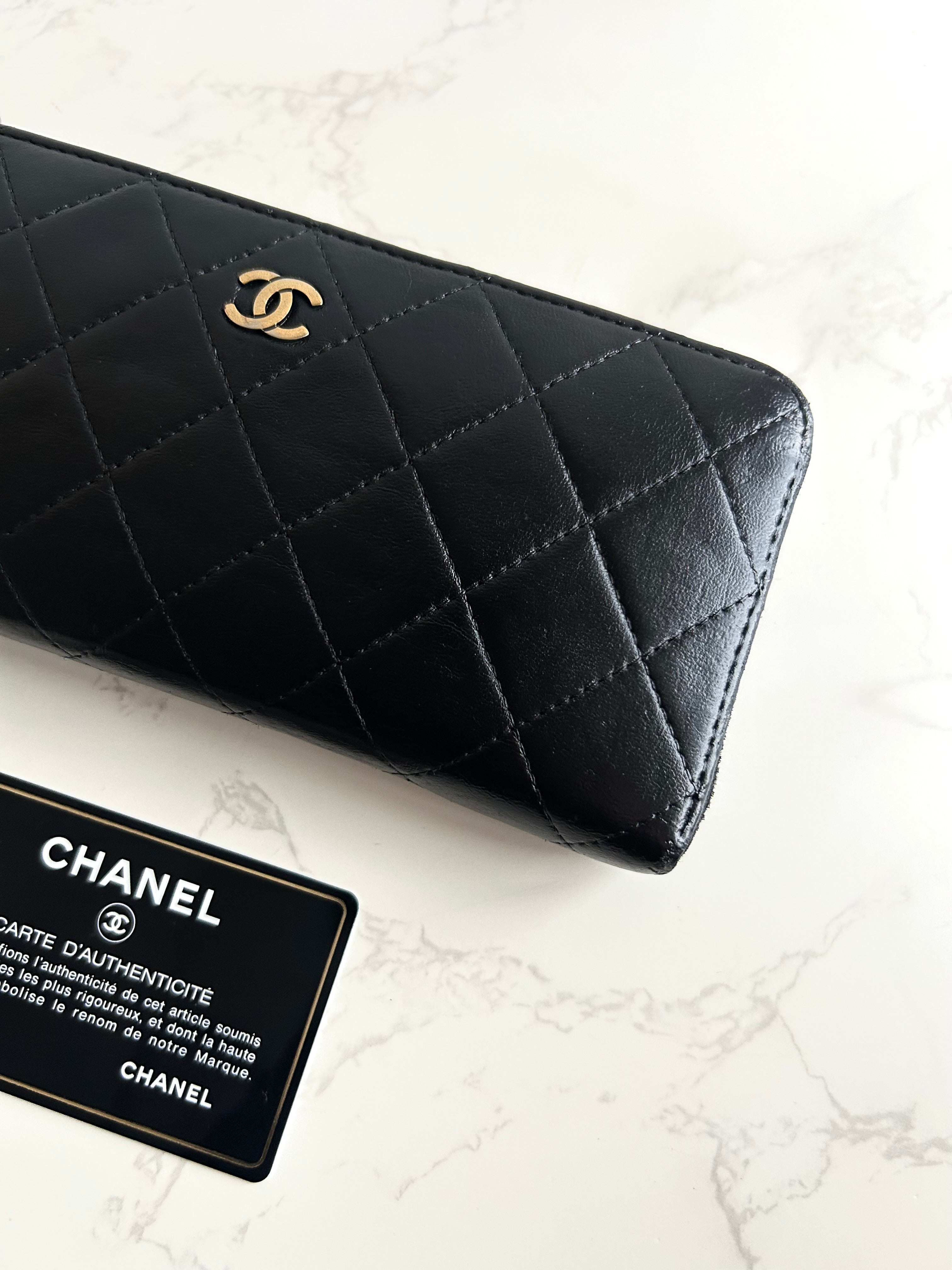 Recent season Chanel black and gold lambskin long wallet