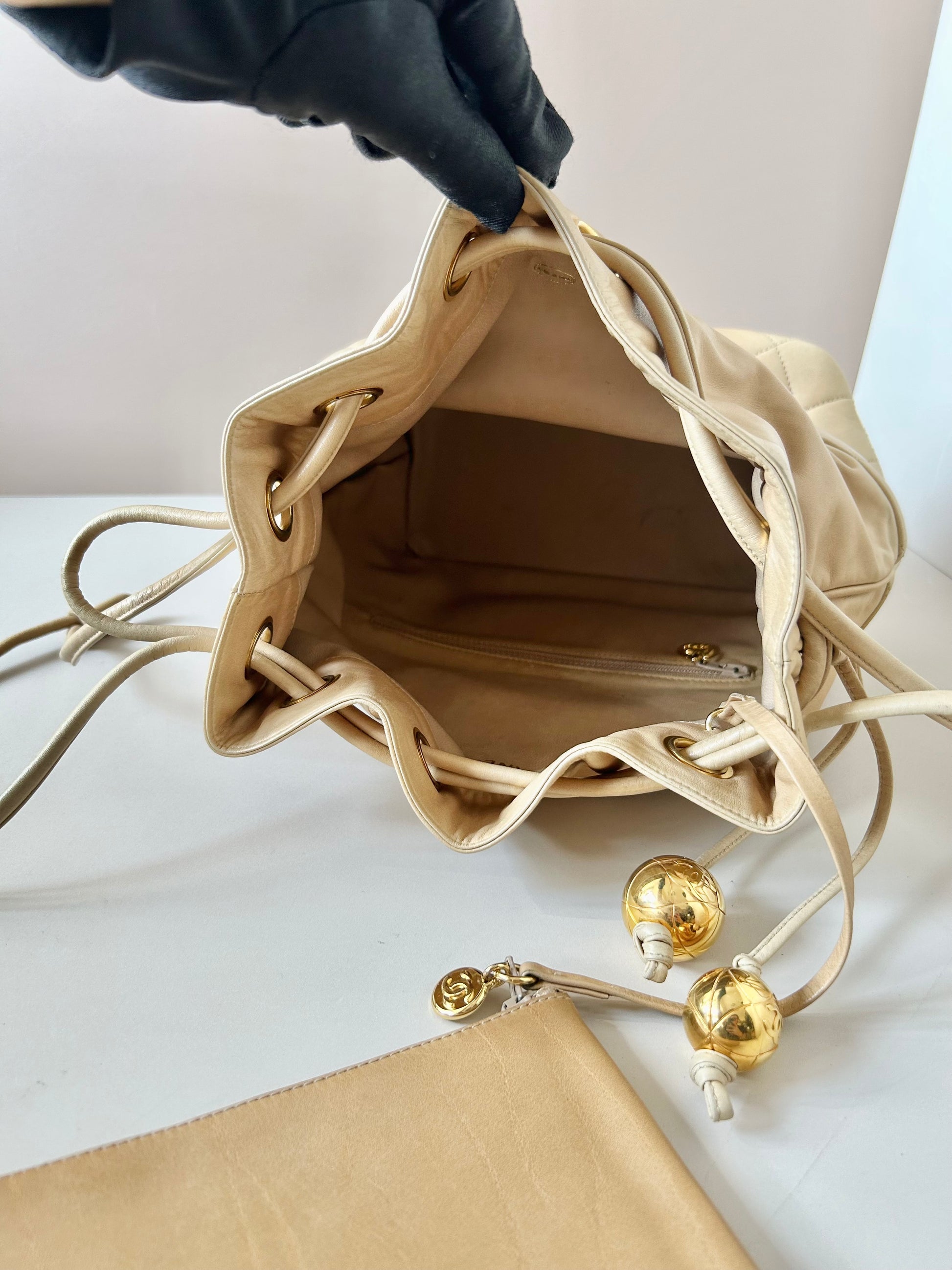 CHANEL rare beige lambskin double gold ball drawstring small bucket / side bag