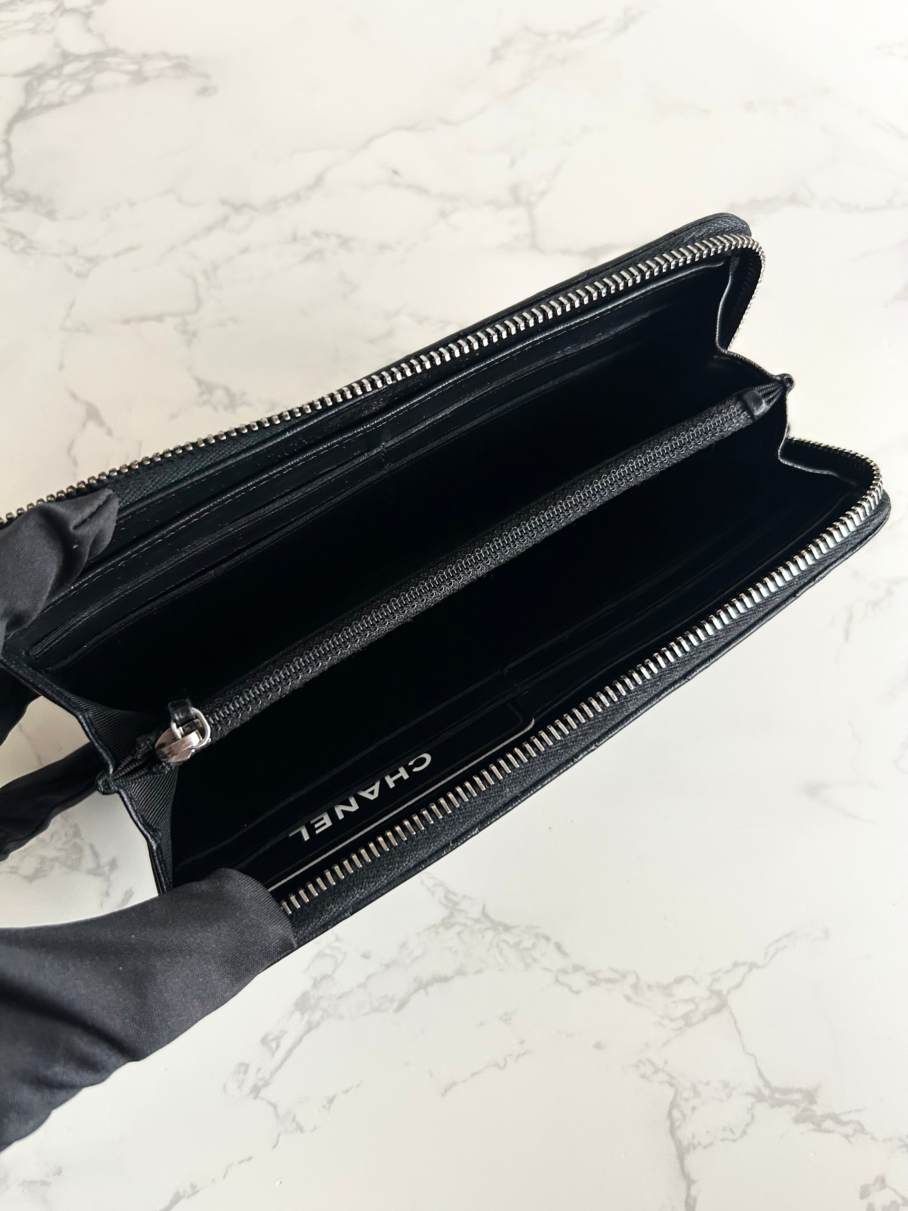 Recent season Chanel black and gold lambskin long wallet