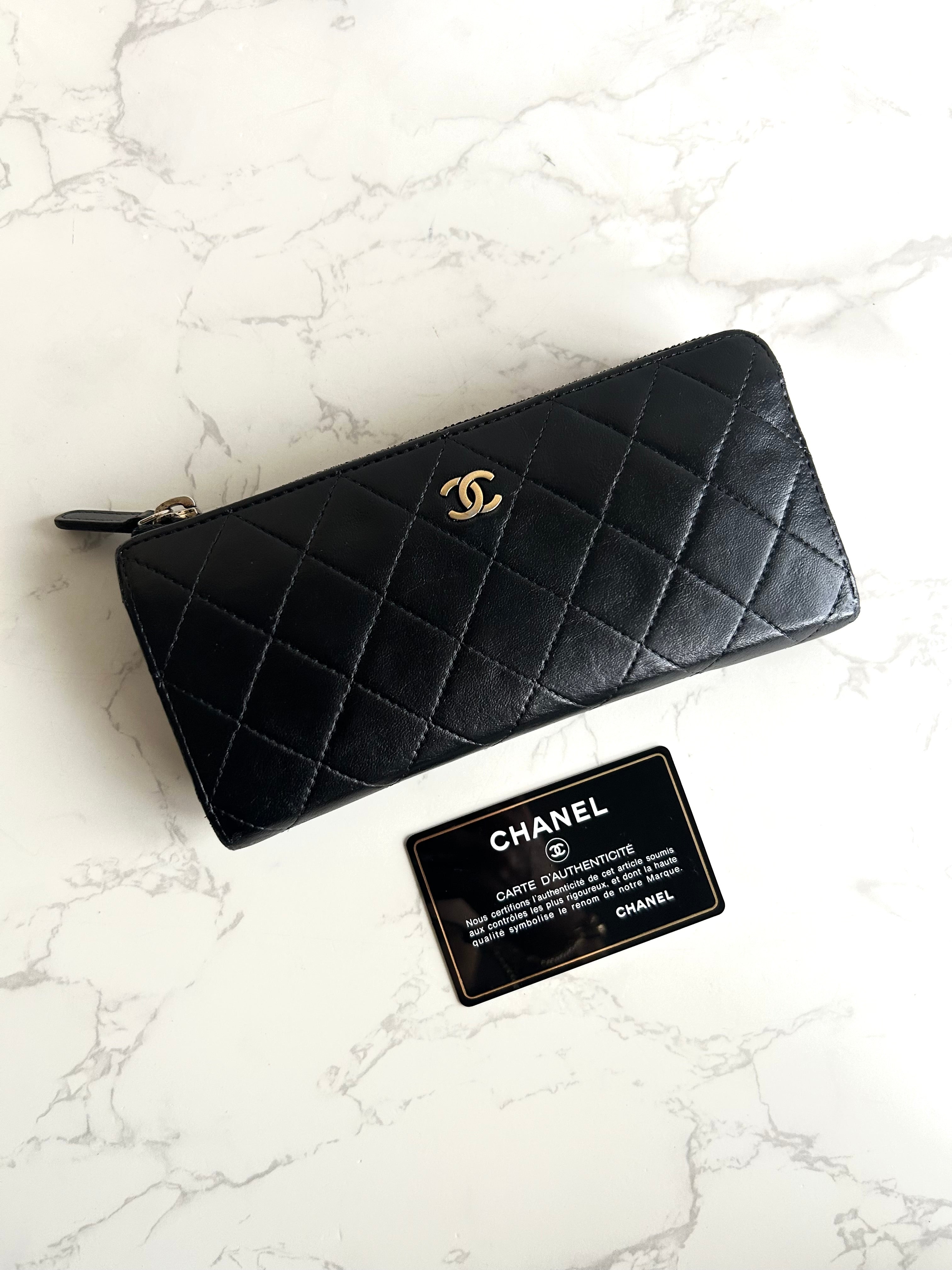 Recent season Chanel black and gold lambskin long wallet