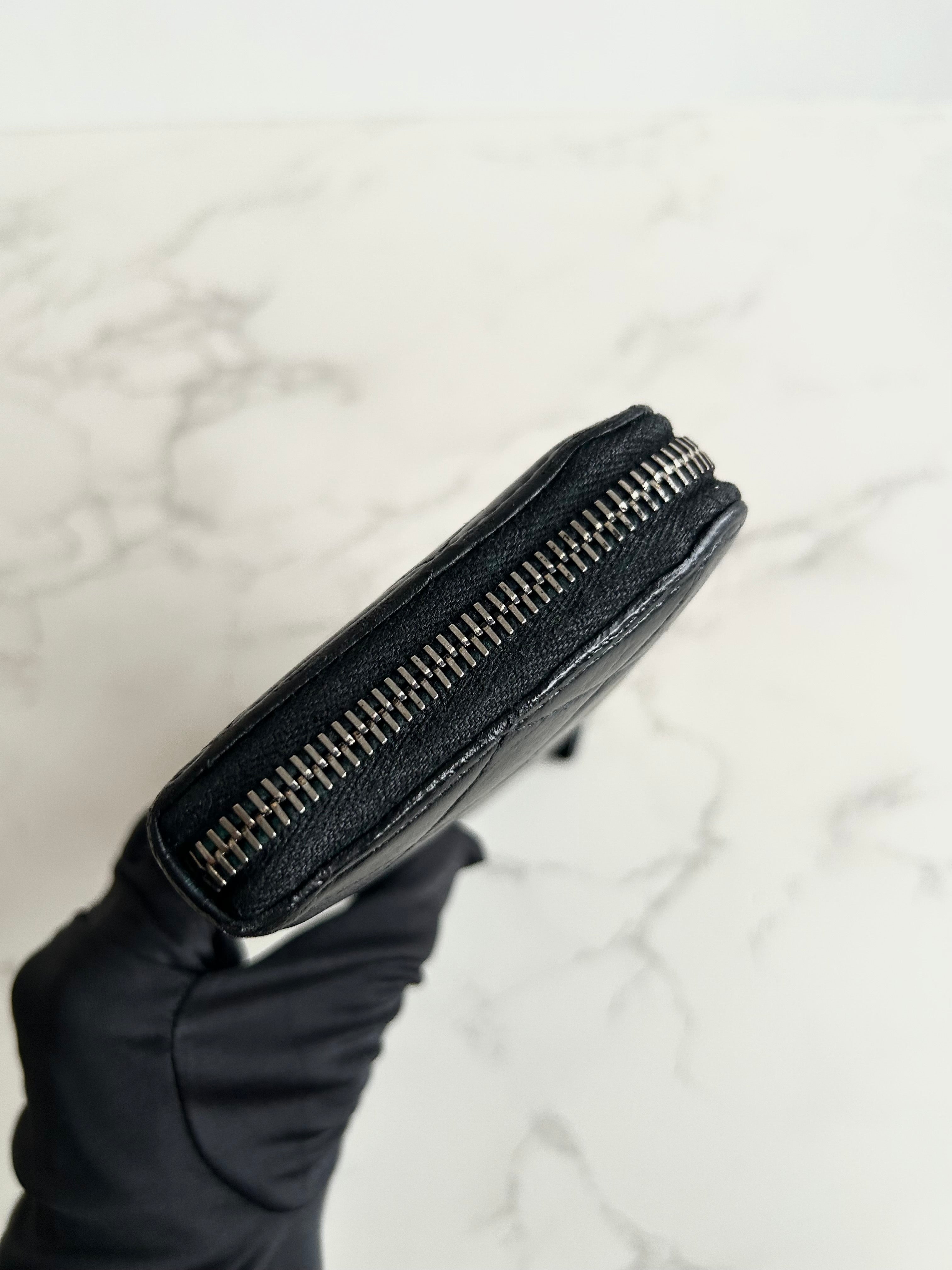 Recent season Chanel black and gold lambskin long wallet