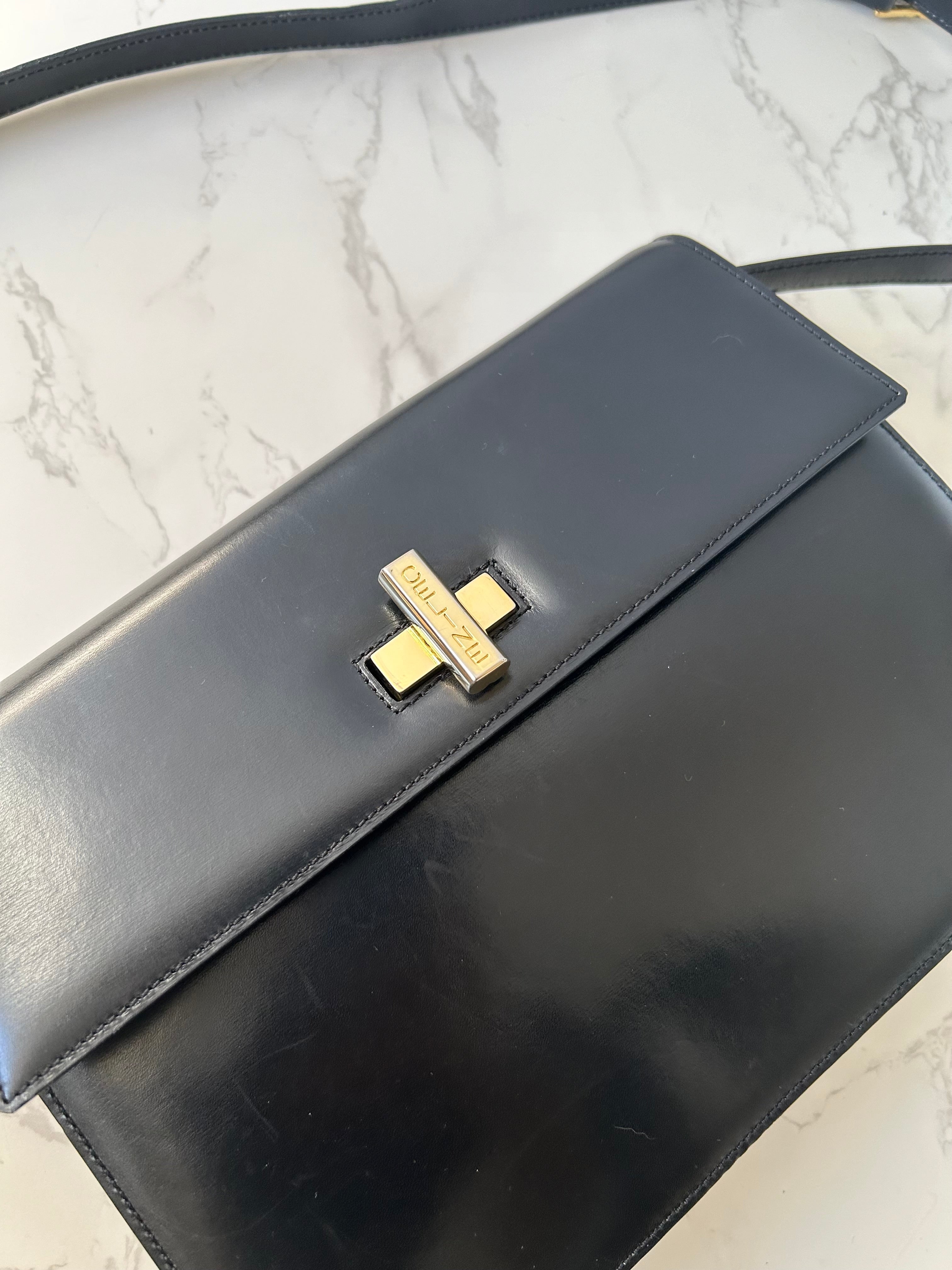 CELINE rare black cross rotating gold buckle leather small shoulder bag / crossbody bag