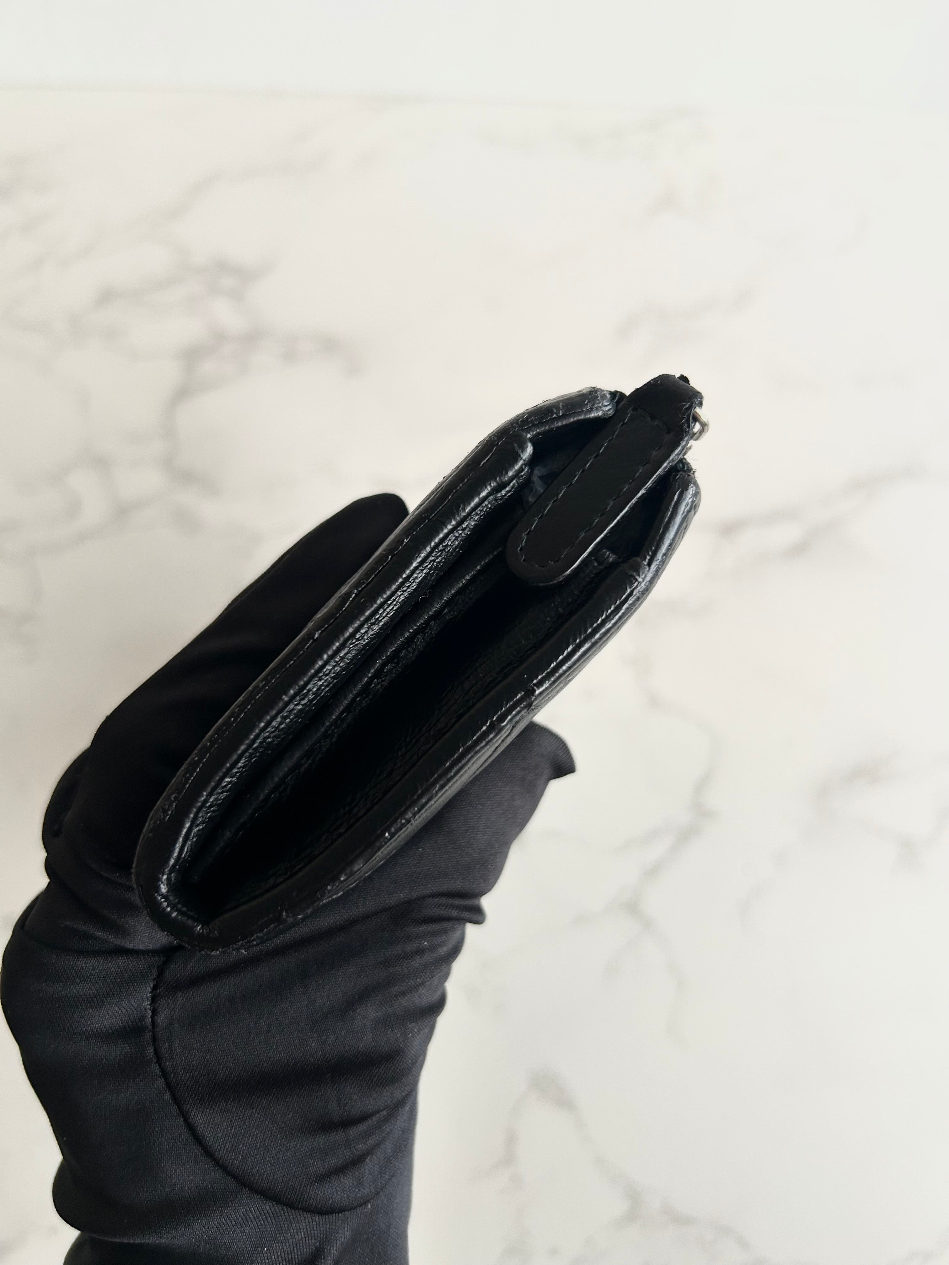 Recent season Chanel black and gold lambskin long wallet