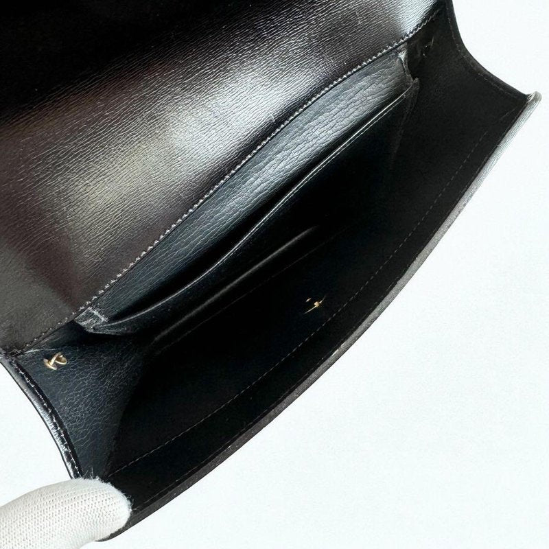 CHRISTIAN DIOR Black leather shoulder bag with gold buckle and chain