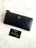 Recent season Chanel black and gold lambskin long wallet