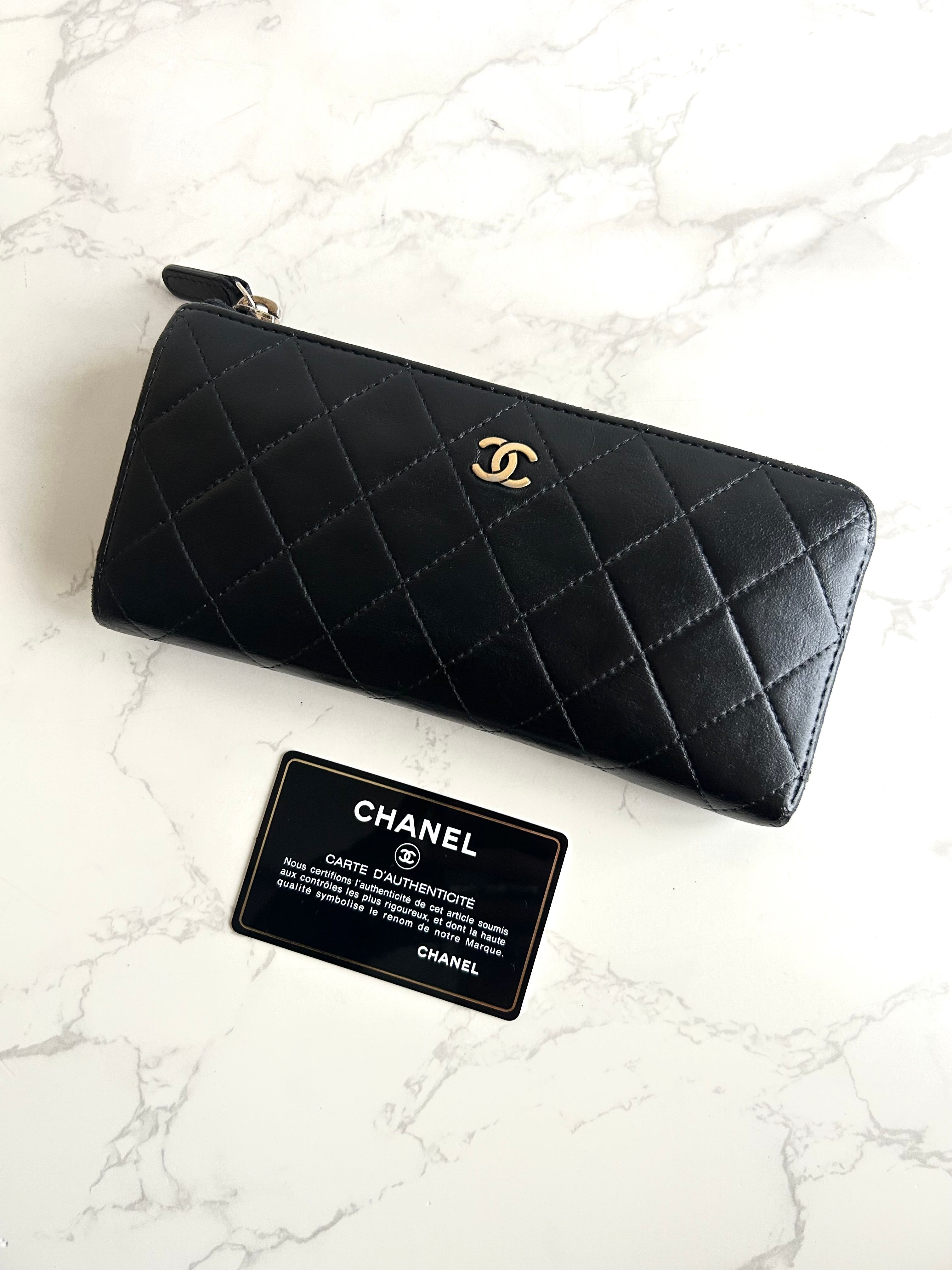 Recent season Chanel black and gold lambskin long wallet