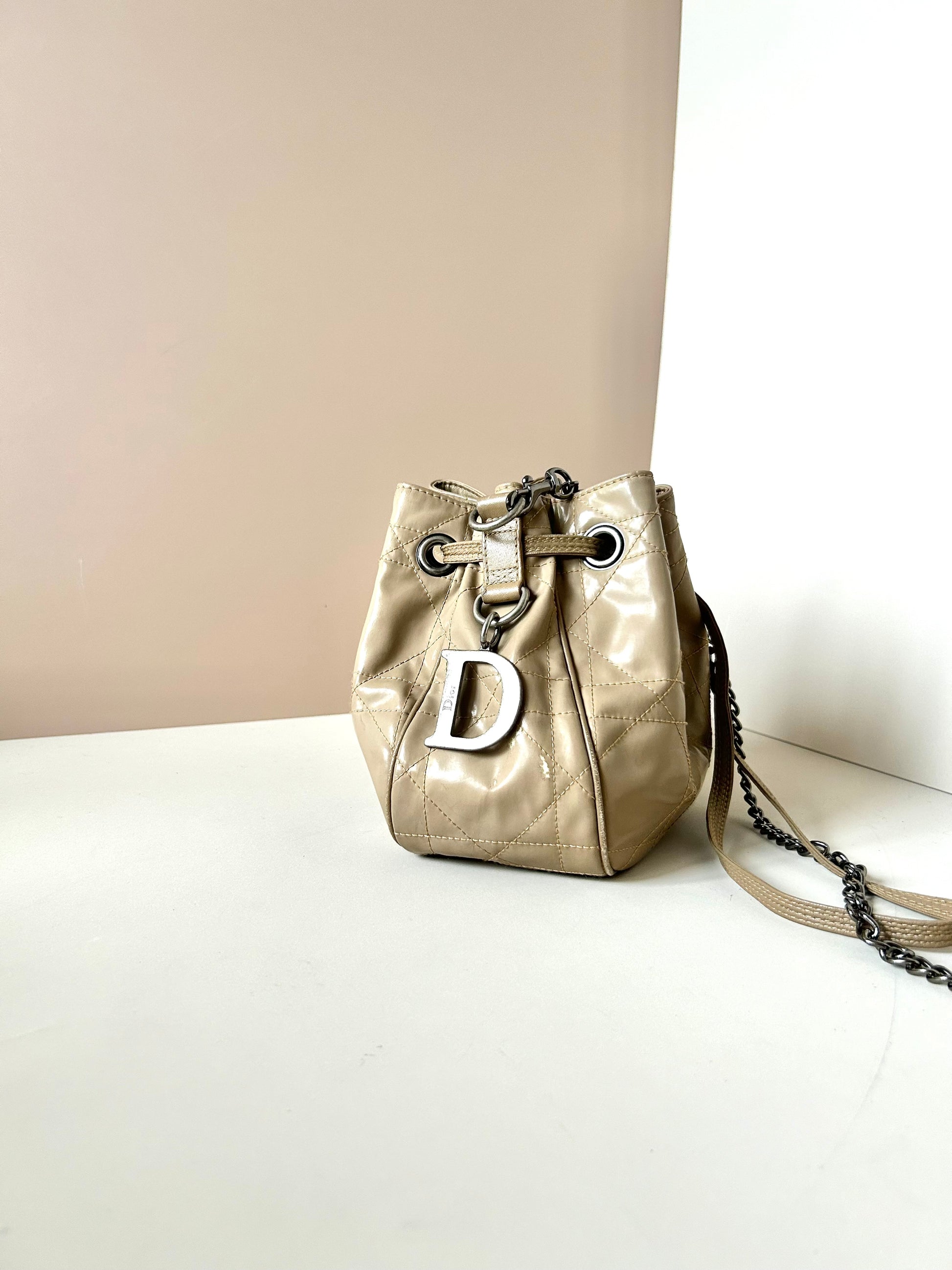 CHRISTIAN DOR beige leather silver buckle drawstring small bucket bag / side backpack / shoulder bag