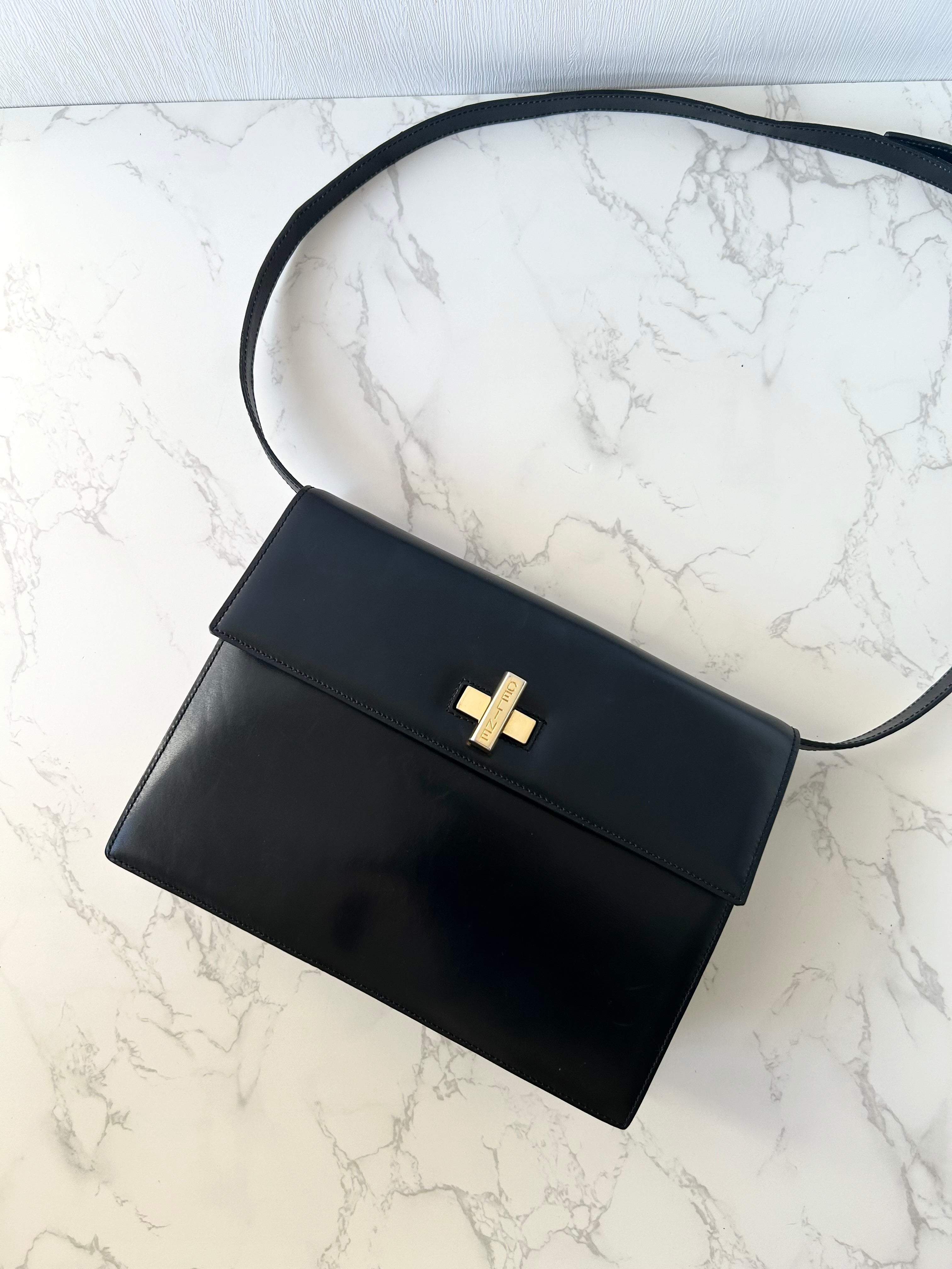 CELINE rare black cross rotating gold buckle leather small shoulder bag / crossbody bag