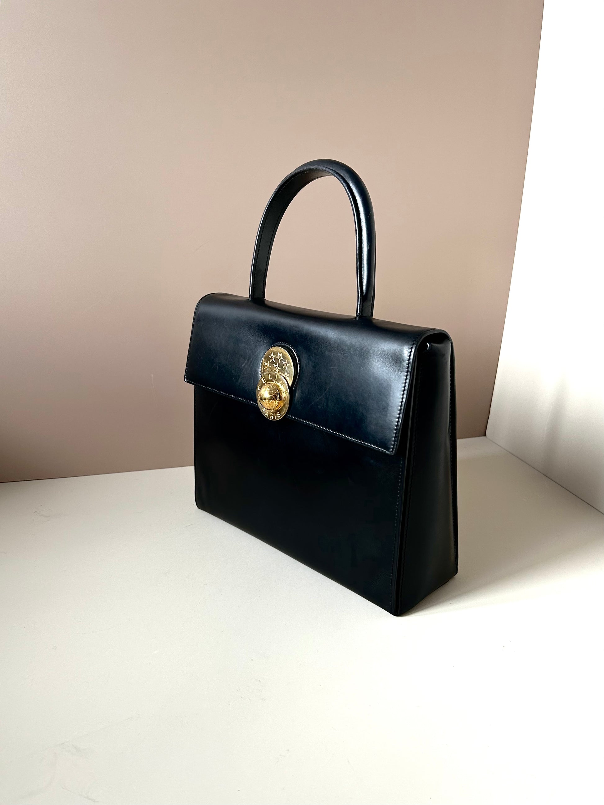 CELINE rare rotating moving gold planet black leather Kelly small bag / handbag
