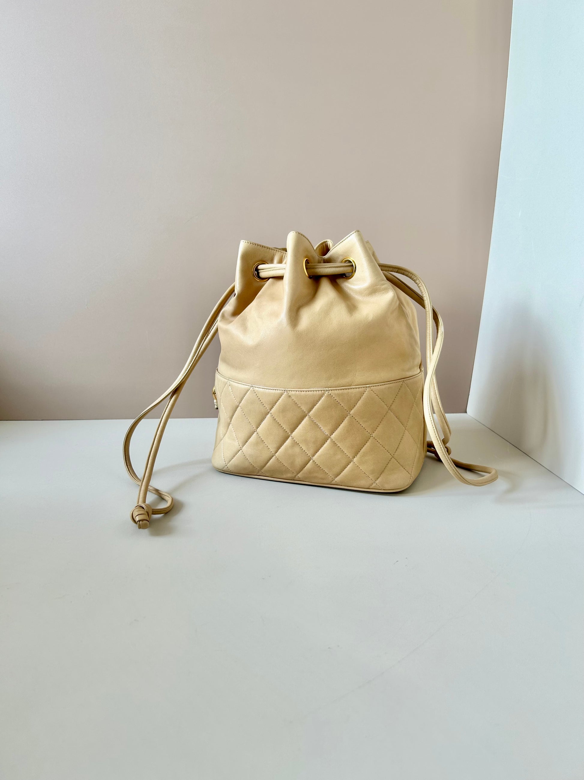 CHANEL rare beige lambskin double gold ball drawstring small bucket / side bag