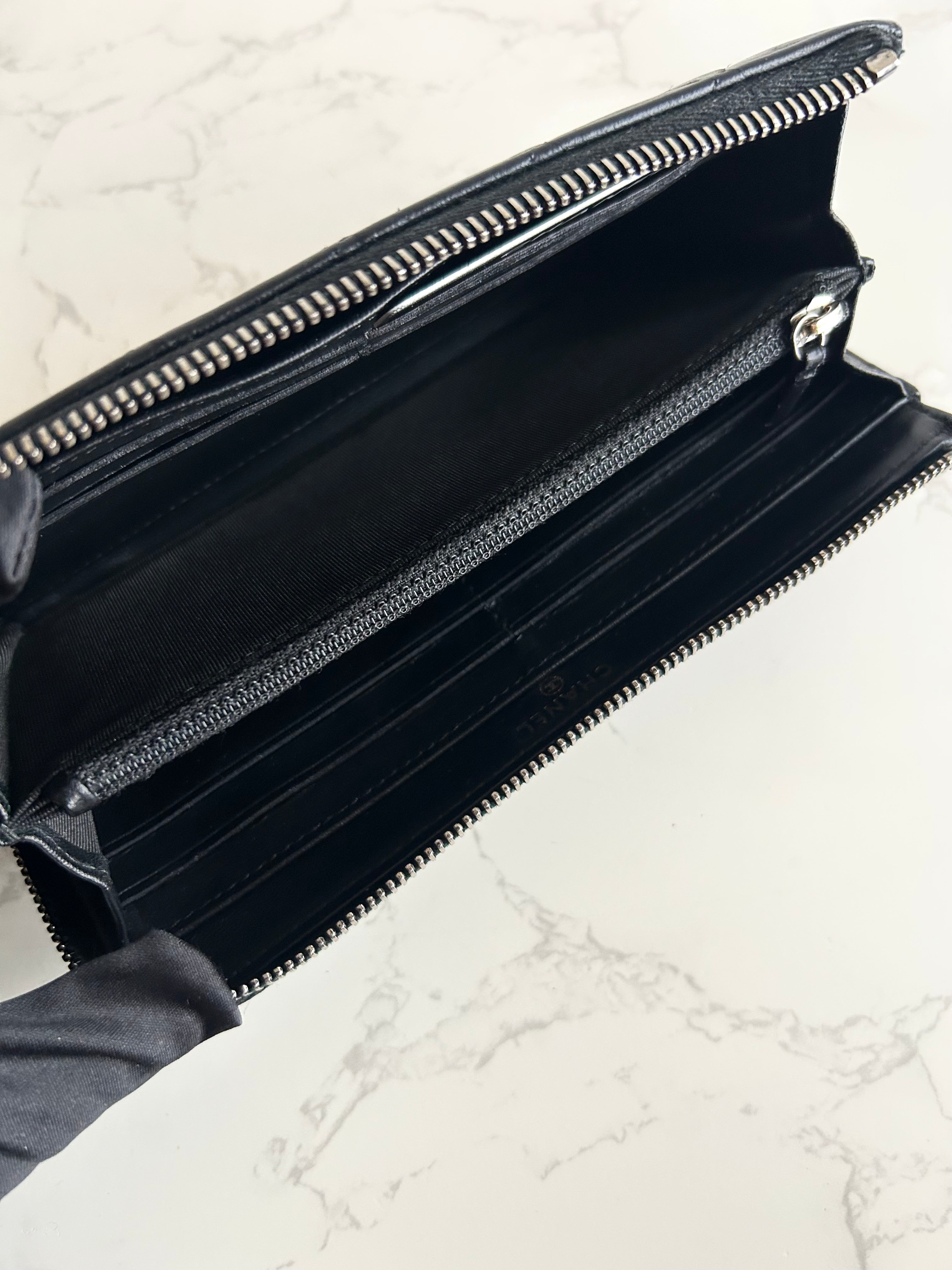 Recent season Chanel black and gold lambskin long wallet