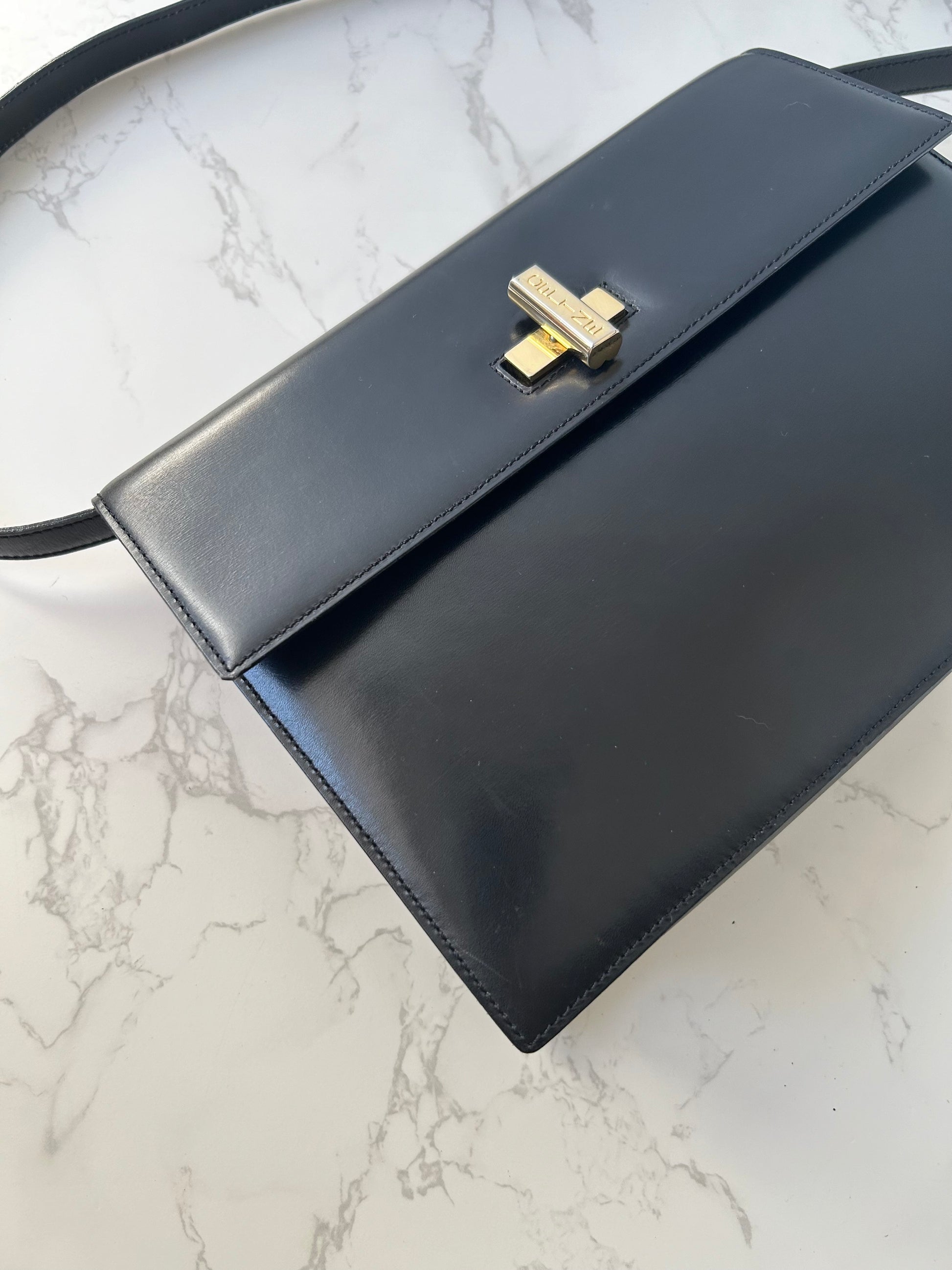 CELINE rare black cross rotating gold buckle leather small shoulder bag / crossbody bag