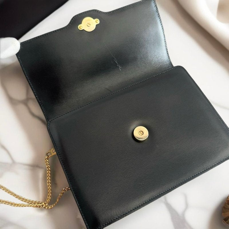 CHRISTIAN DIOR Black leather shoulder bag with gold buckle and chain