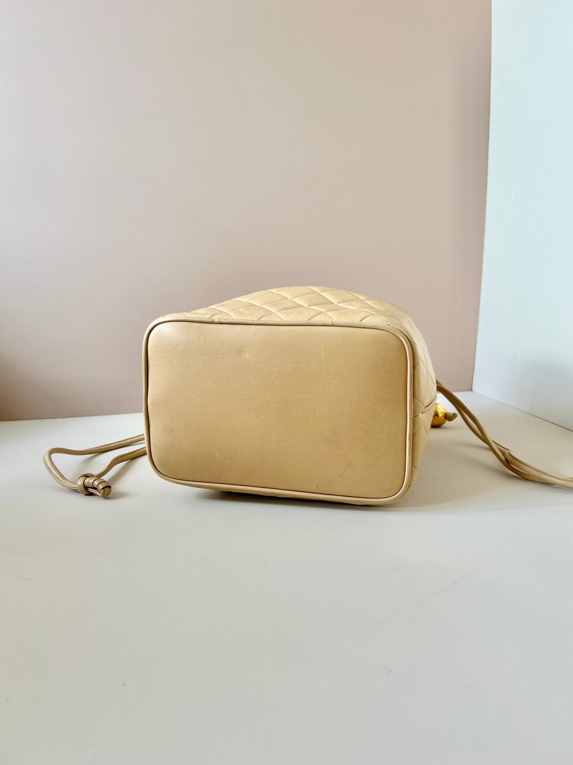 CHANEL rare beige lambskin double gold ball drawstring small bucket / side bag