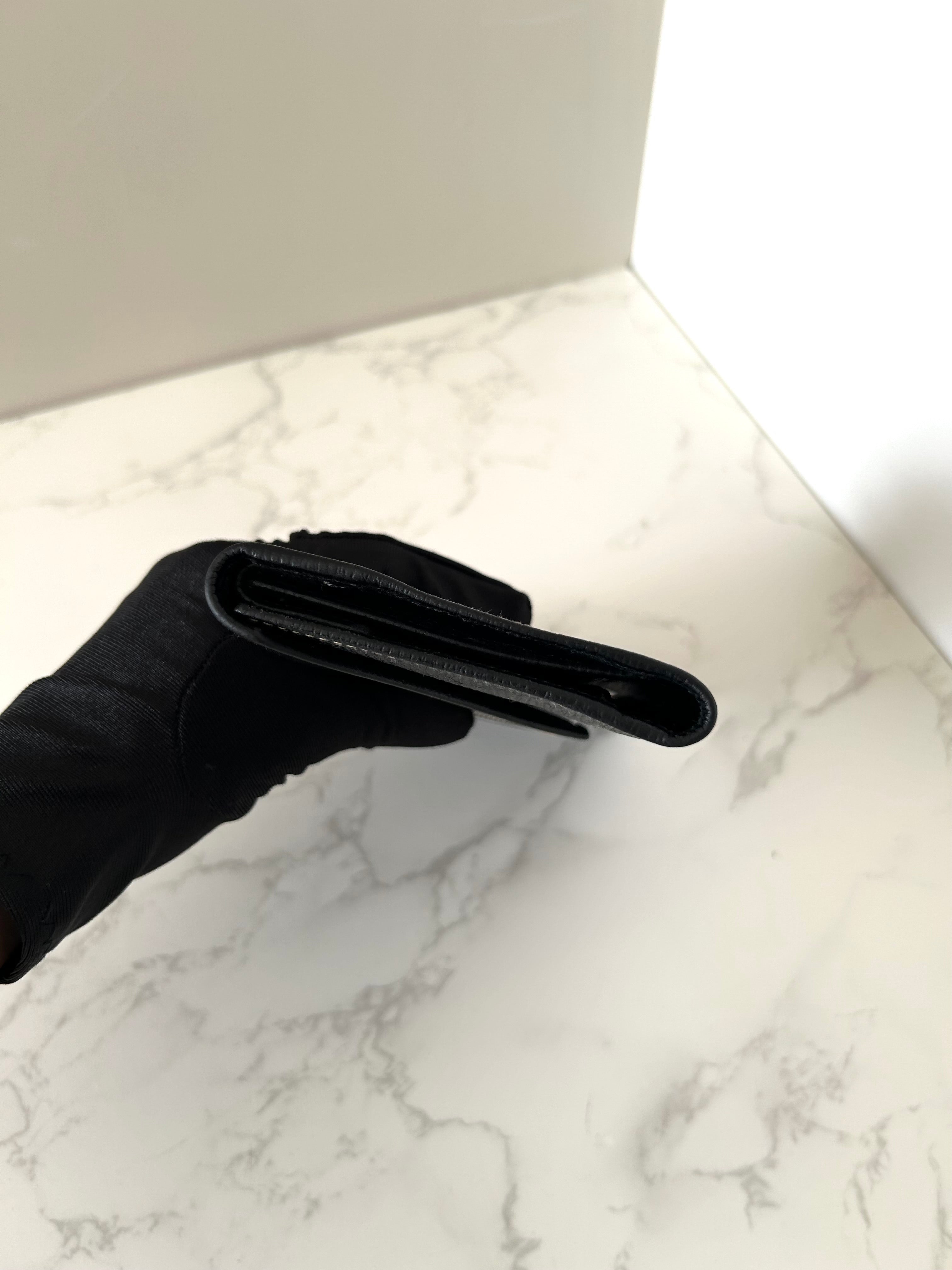 CELINE black gold ring leather long wallet / wallet