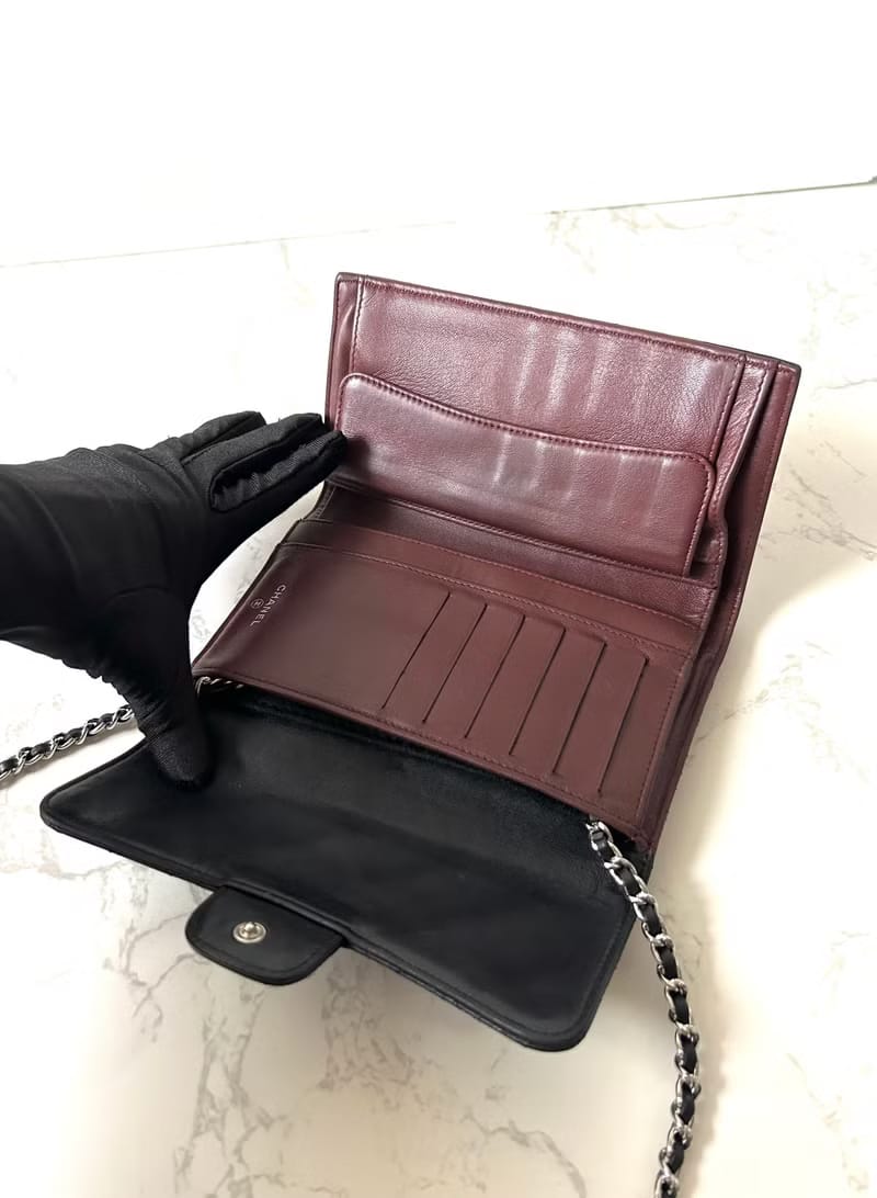 Second-hand Chanel black lambskin leather WOC shoulder bag/crossbody bag/wallet