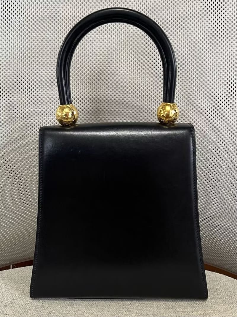 Rare second-hand Celine double gold planet black leather handbag