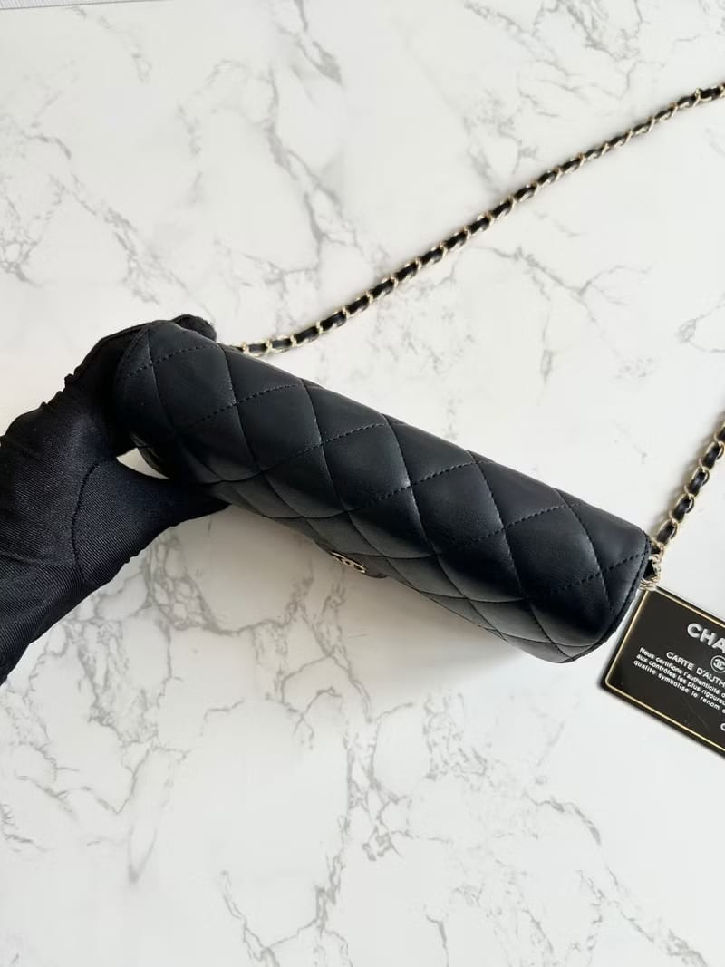 Chanel black WOC leather side bag/oblique bag/long clip