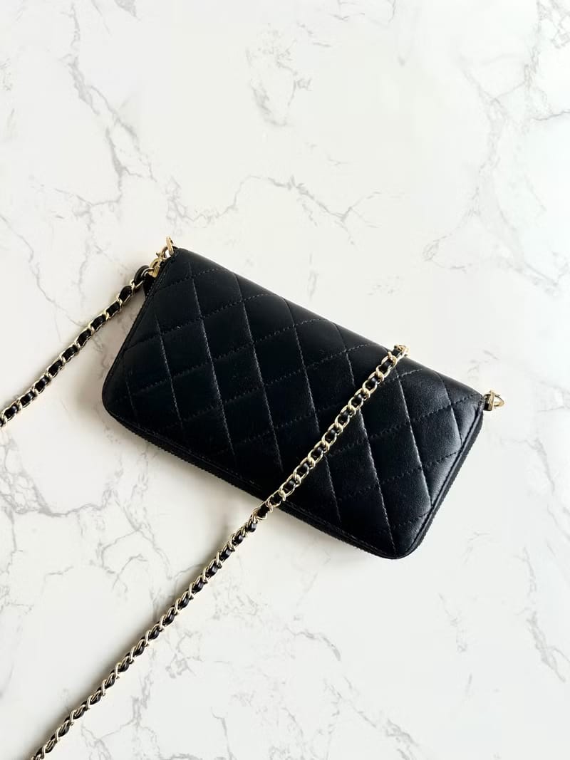 Chanel black WOC leather side bag/oblique bag/long clip