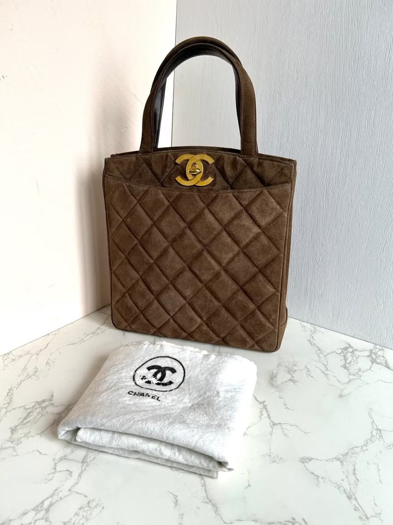 Chanel咖啡金色旋轉扣凱莉包/手提包