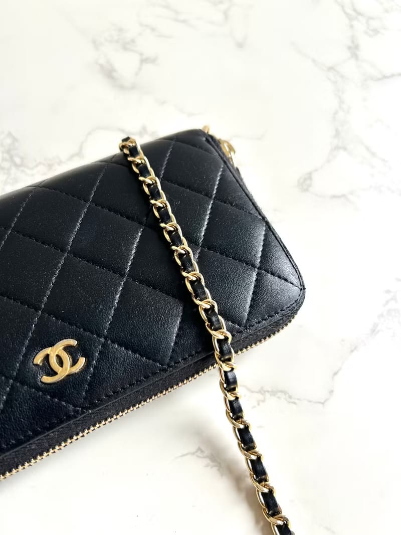Chanel black WOC leather side bag/oblique bag/long clip
