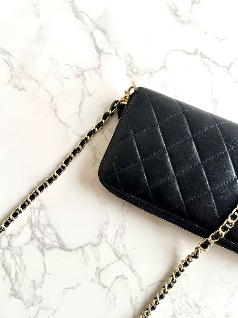 Chanel black WOC leather side bag/oblique bag/long clip