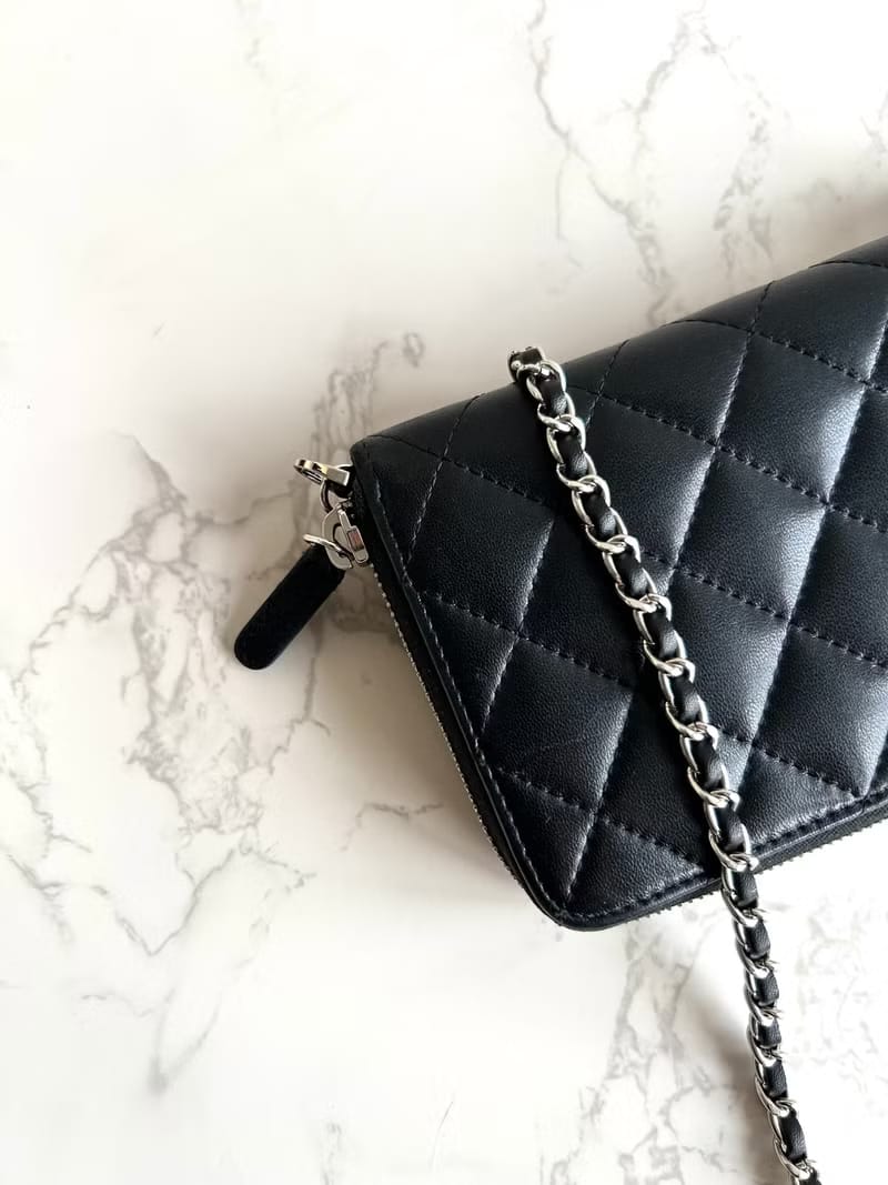 Chanel black WOC leather side bag/oblique bag/long clip