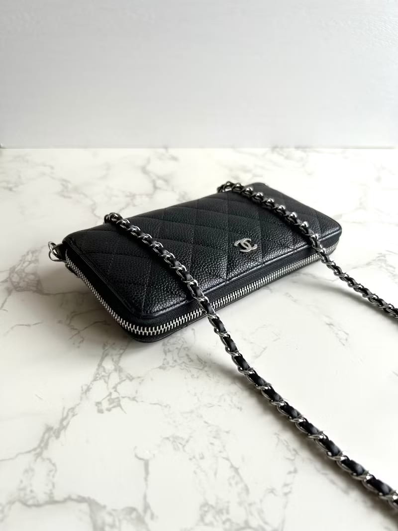 Chanel black WOC leather side bag/oblique bag/long clip