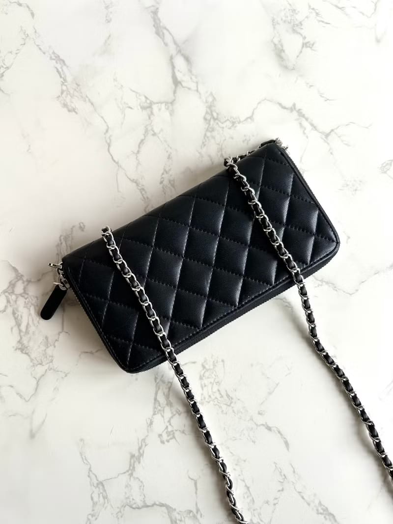 Chanel black WOC leather side bag/oblique bag/long clip